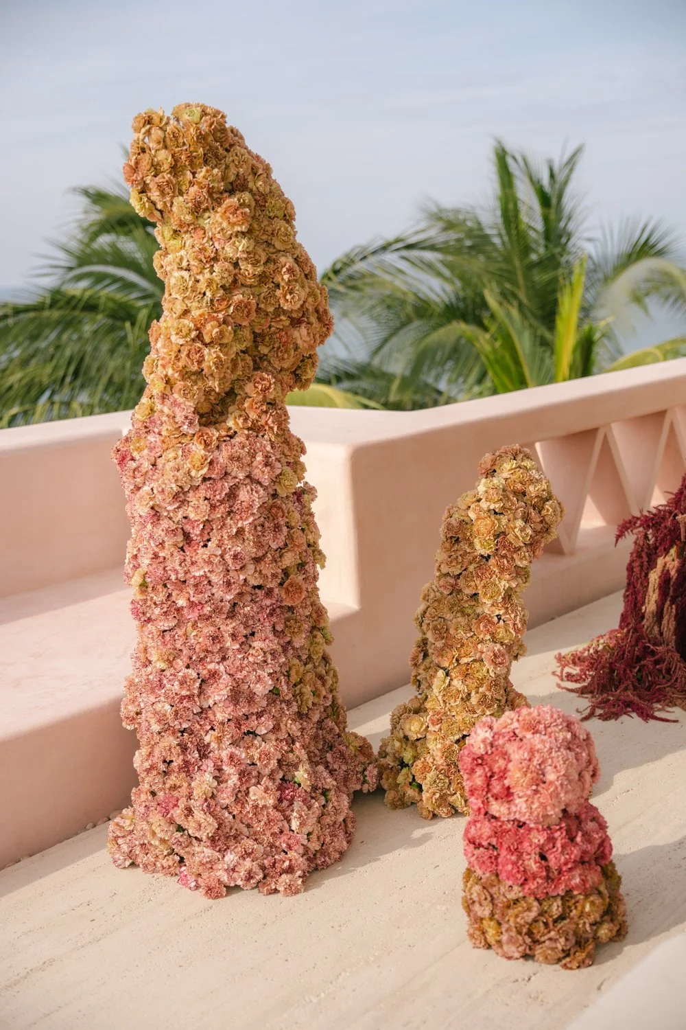 Aesthetic destination wedding in Mexico with sculptural florals and ocean views photographed by Mexico destination wedding photographer Victoria Kait