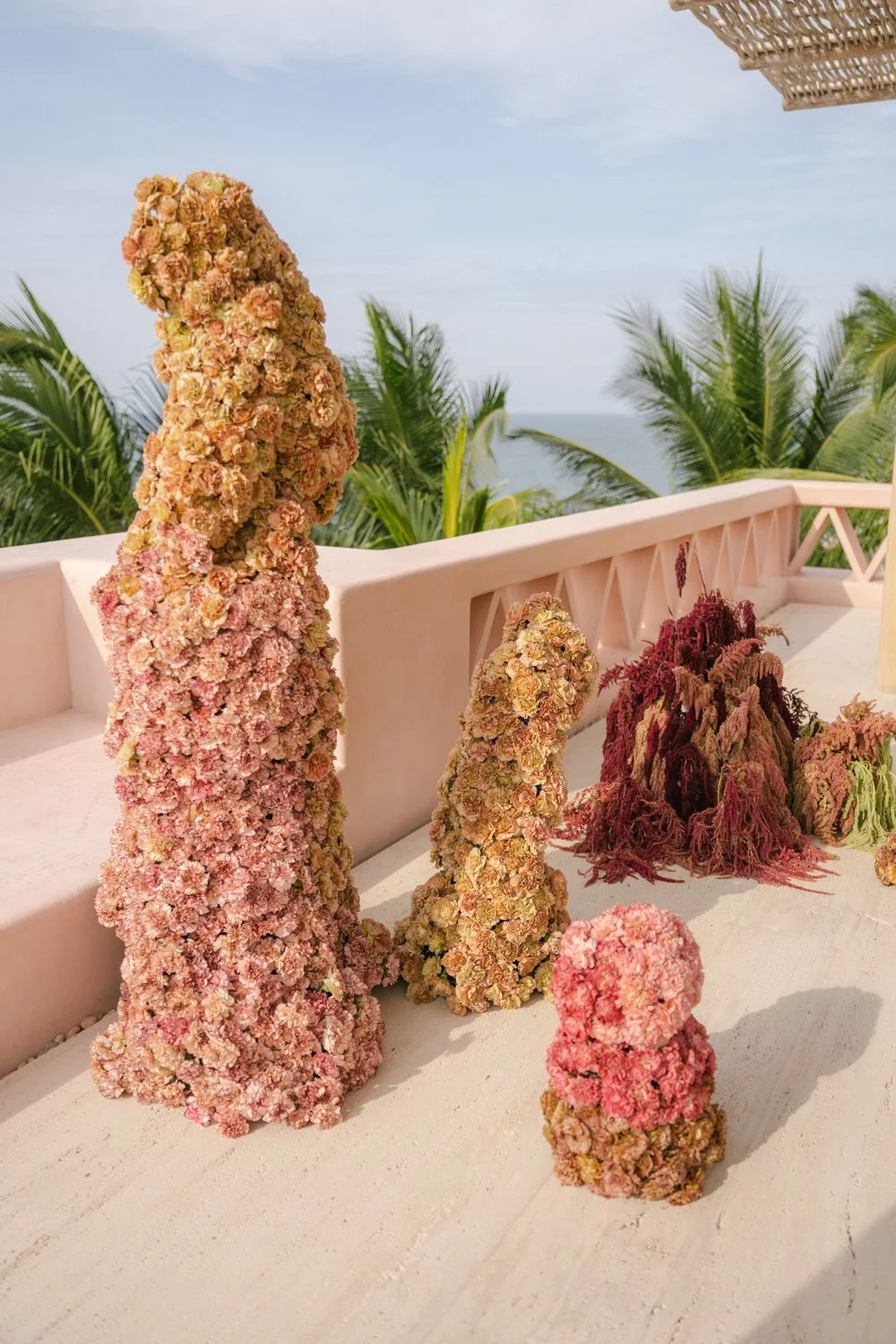 Aesthetic destination wedding in Mexico with sculptural florals and ocean views photographed by Mexico destination wedding photographer Victoria Kait