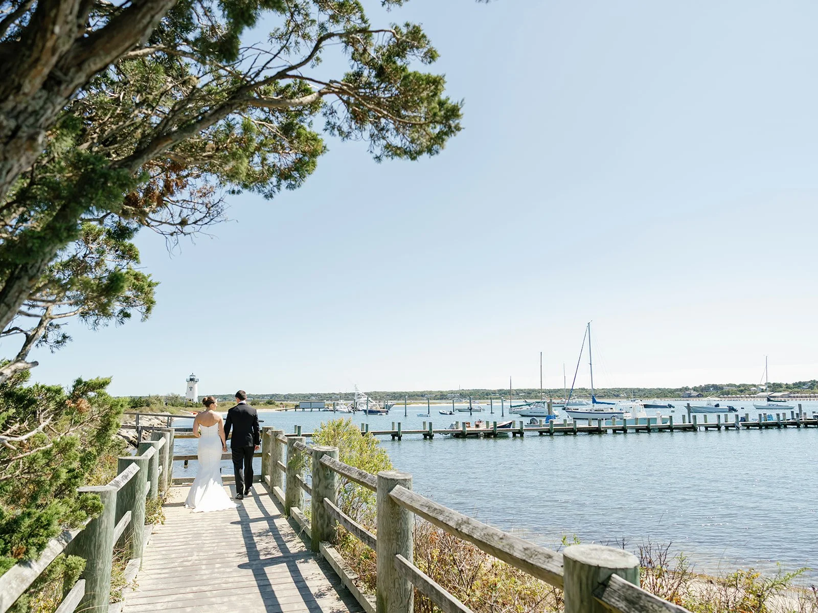 Bride and Groom Walking Down Dock in Marthas Vineyard