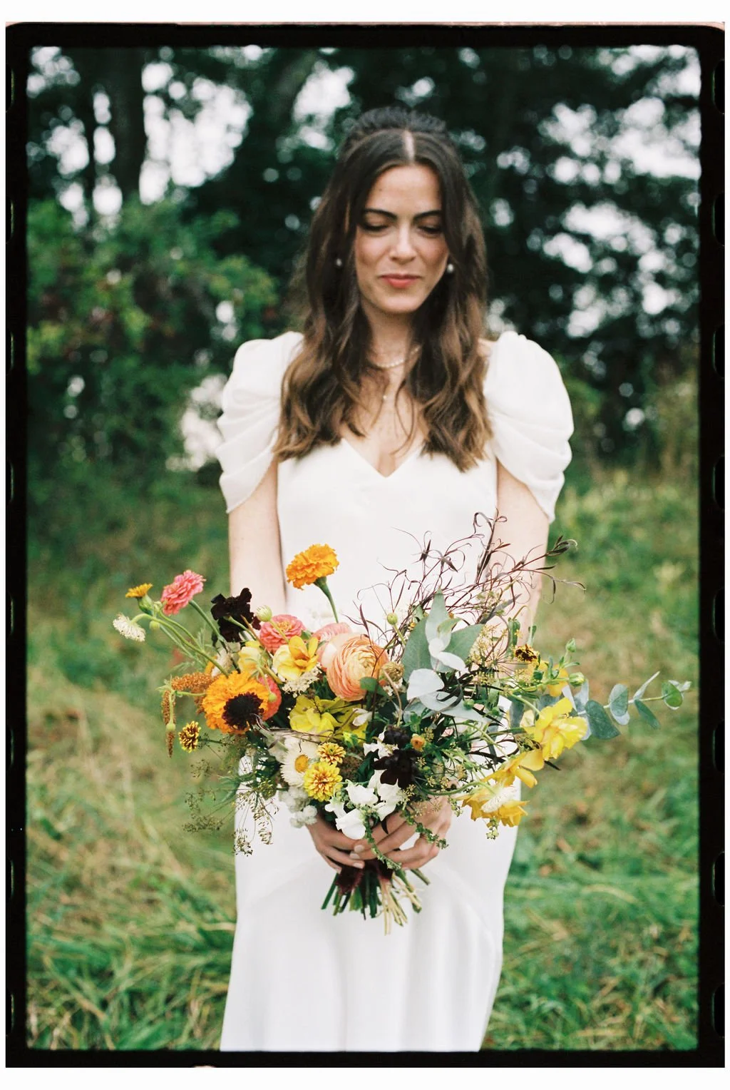 Bride Holding Bouquet Before Walking Down Aisle of Maine Wedding