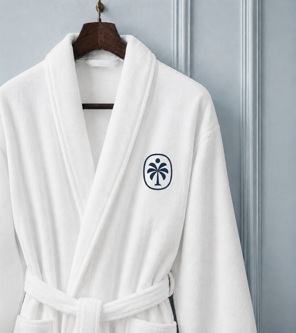 Palmera Boutique Hotel branding applied to the embroidered coat of a tropical boutique hotel in Tulum, Mexico.