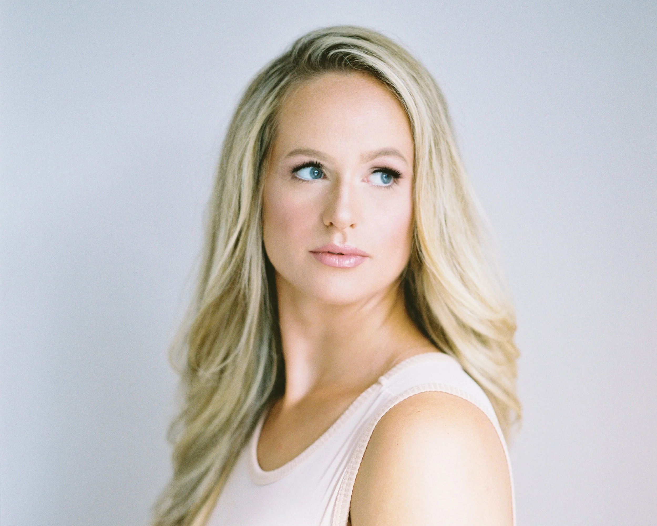 Personal makeup artist creating a relaxed, confidence-building experience for a professional client in Toronto