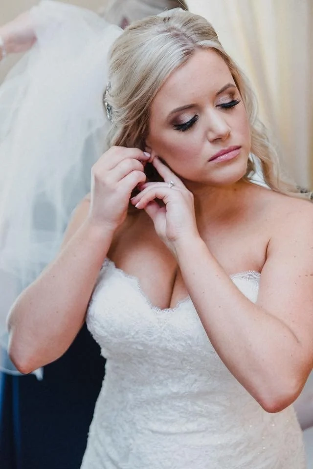 Professional makeup artist creating a refined, confidence boosting natural soft glam makeup look for a bridal makeup client, emphasizing precision, natural enhancement, and luxury service
