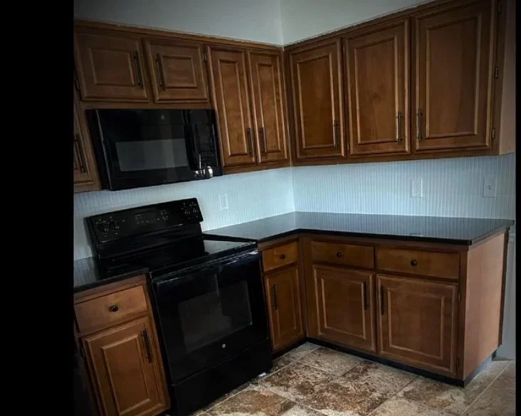 Beautiful kitchen renovation with a beautiful white backsplash by Columbus GA handyman