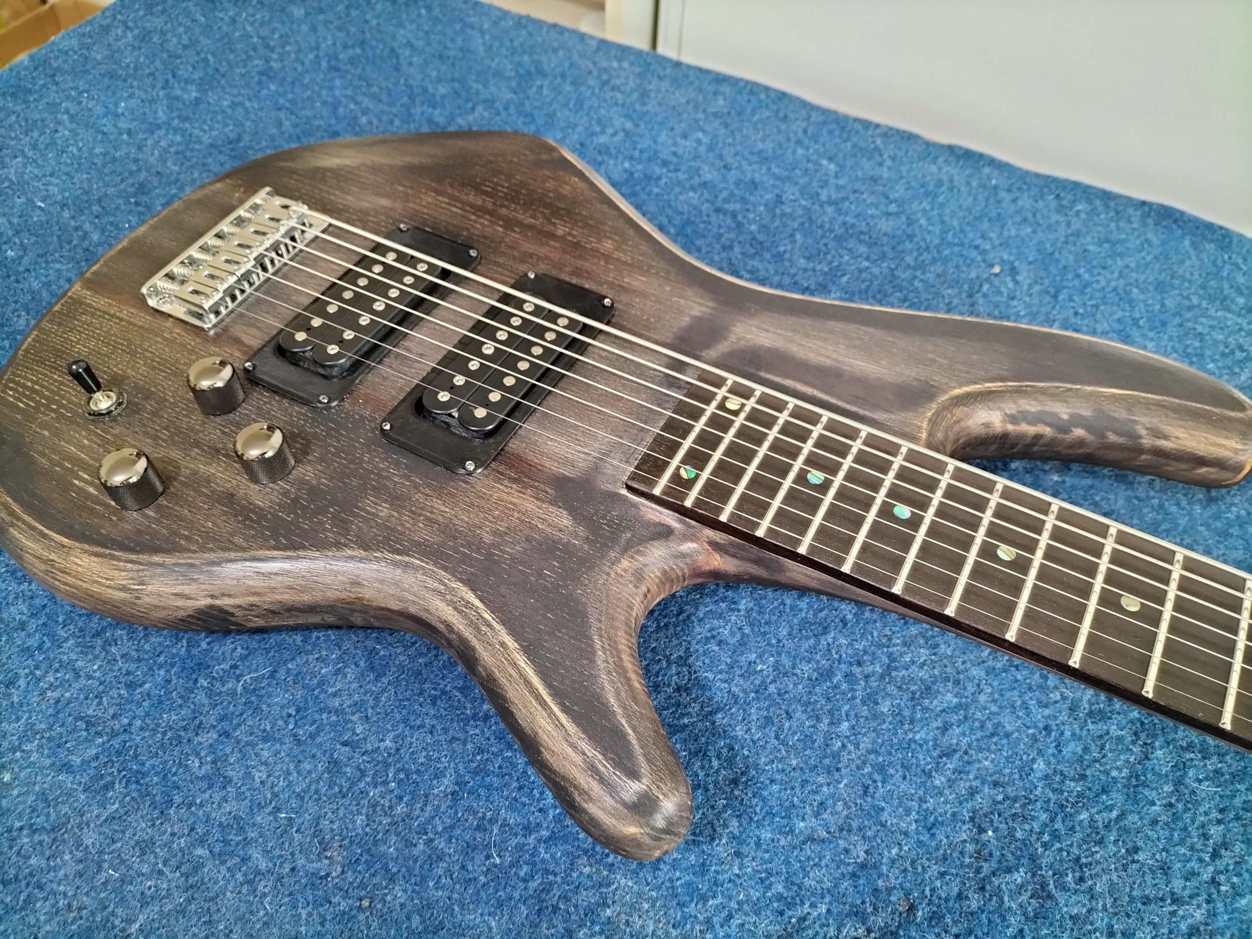 My customer's dream was to have a ultra-low tuned 7 string guitar, so we converted this 5 string bass to a 7 string baritone guitar. It worked really well, and was insanely heavy!