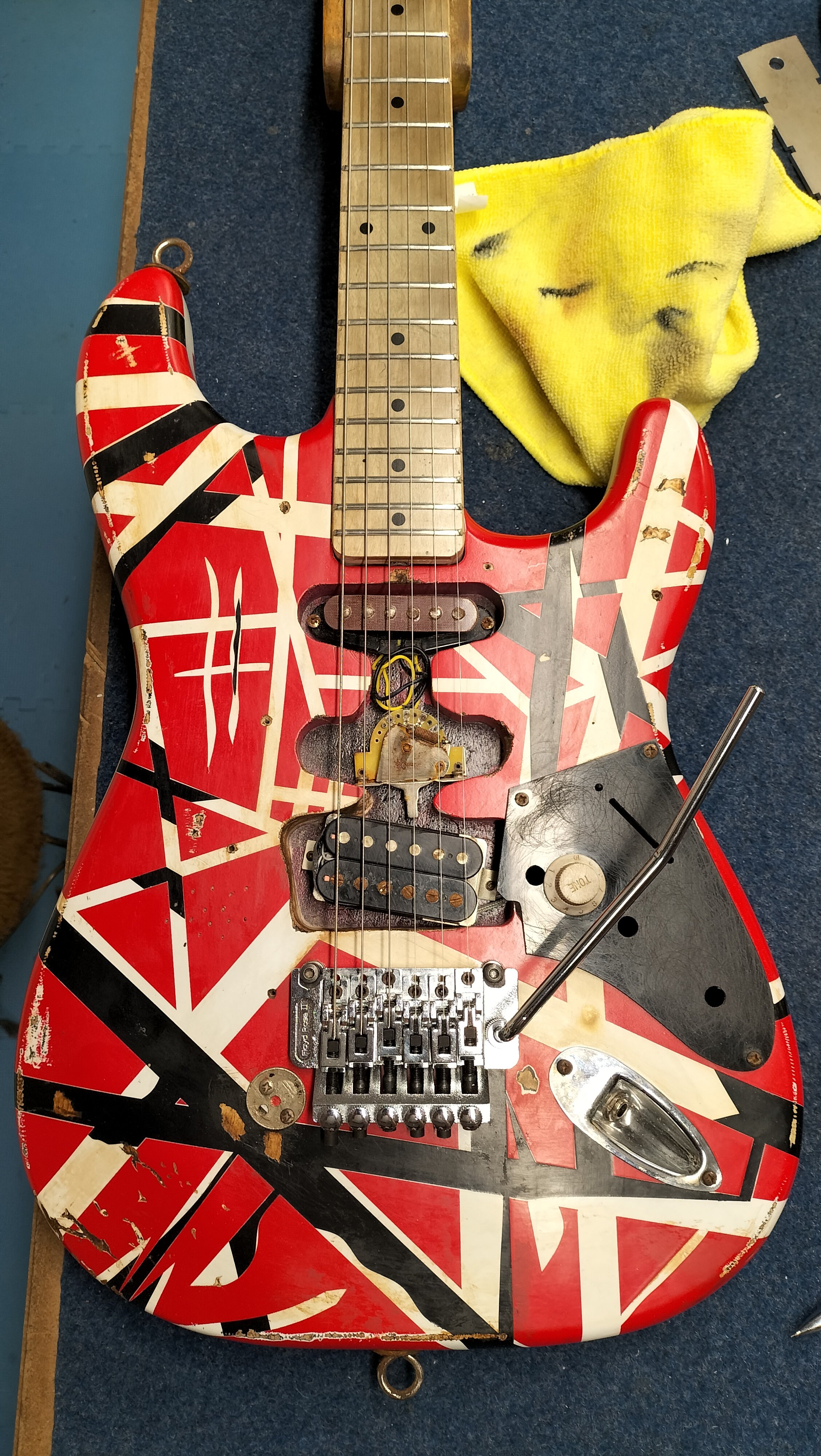 This particular guitar is a replica of the very famous 'Frankenstrat' owned by Eddie Van Halen. I was asked to install a custom pickup and to add some fine details to make it as accurate as possible. It turned out great!