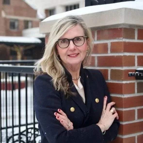 Jen Mackinnon poses for a headshot.