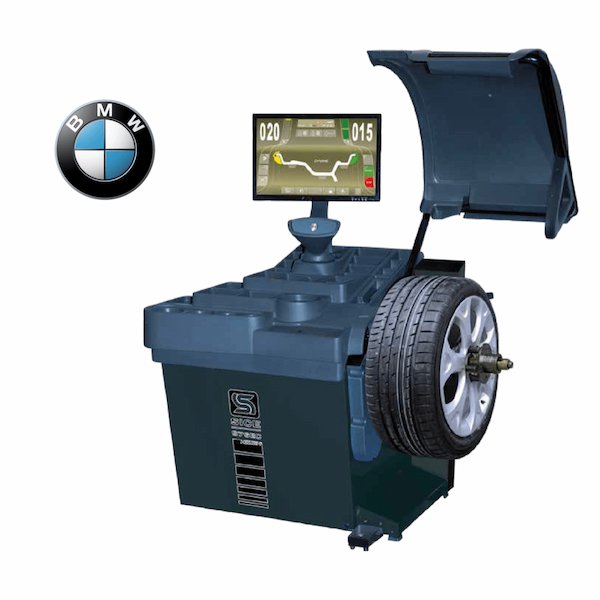 Wheel balancing machine with a mounted wheel and digital display.