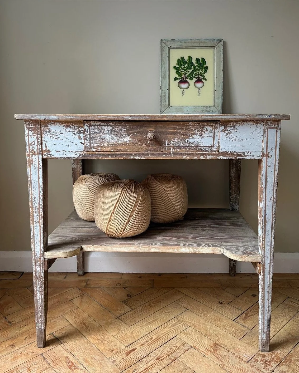 The most gorgeous French prep table with original distressed paint and stacks of unique charm &amp; character. The pale blue grey patina is weathered and worn for that rustic, country style. Chunky timbers with a smooth drawer perched on slender stra