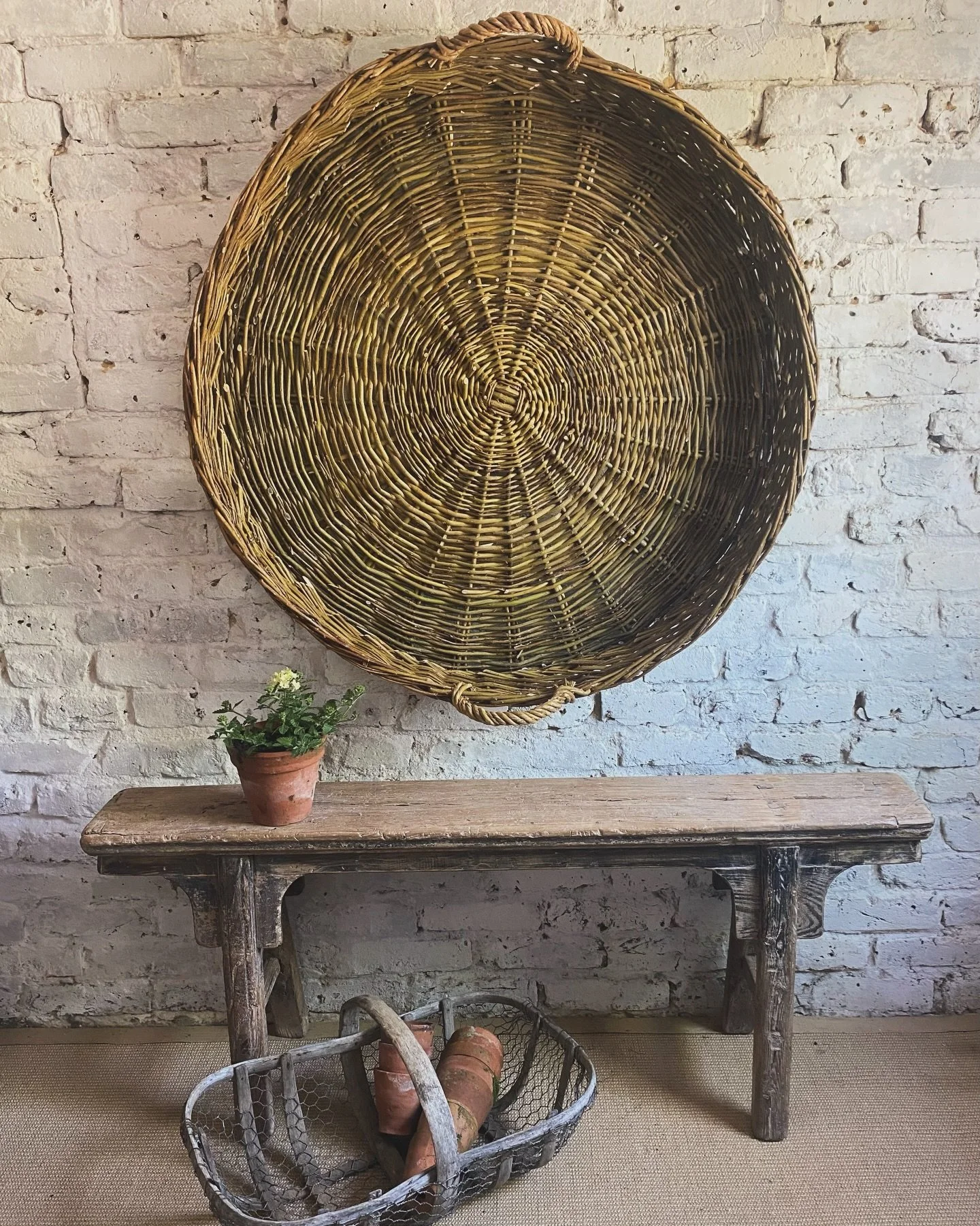 A superb European harvest basket in wonderful earthy tones. Handmade willow construction originally used for agricultural collection although now these impressive baskets can be found hung on walls as textural decoration in farmhouses &amp; rural esc