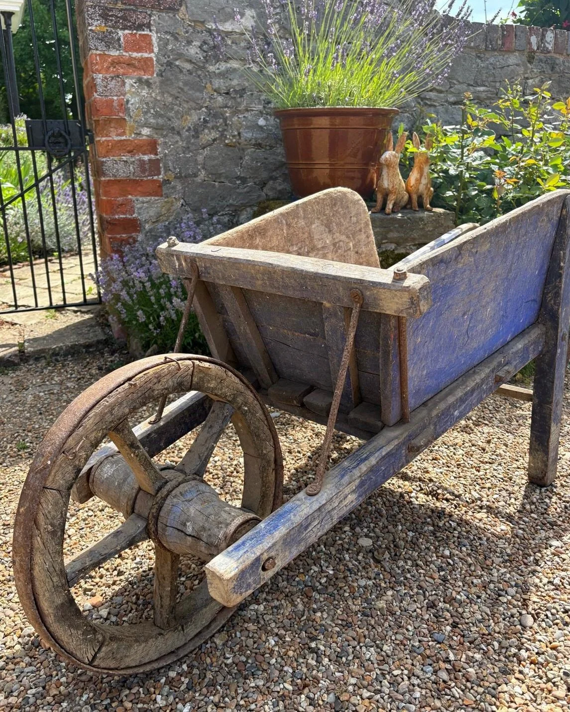 Once a humble workhorse of the French countryside, this beautiful rustic blue wheelbarrow now makes a wonderfully decorative garden feature.

Painted in charrette bleu &mdash; the distinctive blue traditionally seen on shutters throughout Provence &m