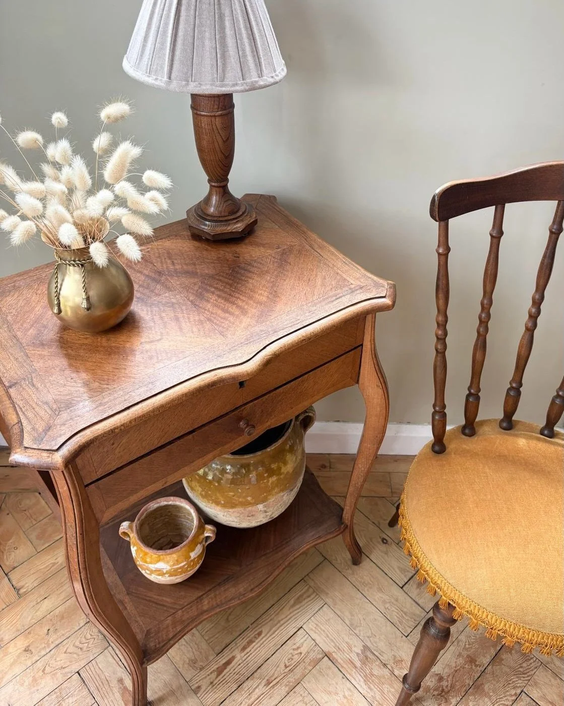 A beautiful French writing desk, full of graceful details and warm, timeworn character.

Crafted in rich walnut with decorative marquetry, this elegant little desk would have been equally at home as a writing desk or sewing table, with its hinged top