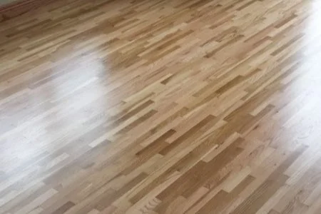 Wooden parquet flooring with a light finish