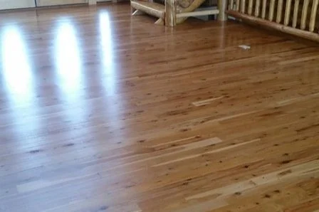 Polished wooden floor with furniture