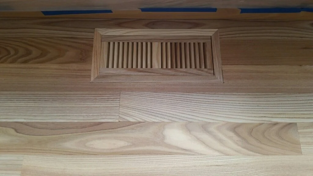 Wood floor with rectangular vent