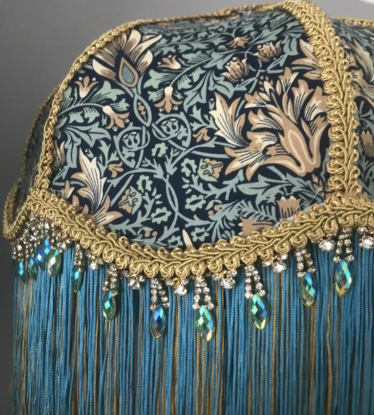 Art deco fringed lampshade in william morris snakeshead tourquiose fabric,close up