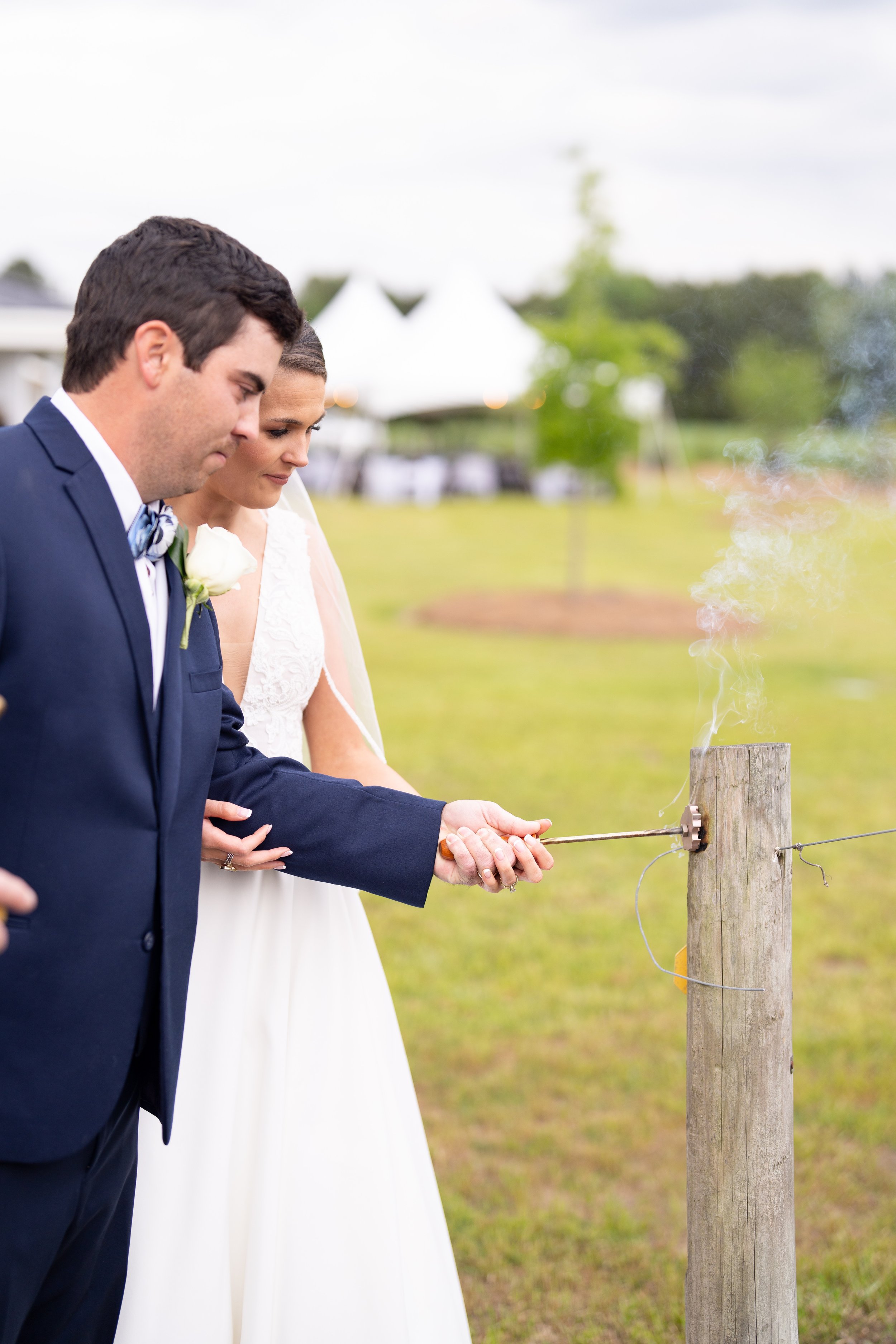 Abbey Marie Photography: Branding tradition a romantic moment with the venue behind the couple and a tent