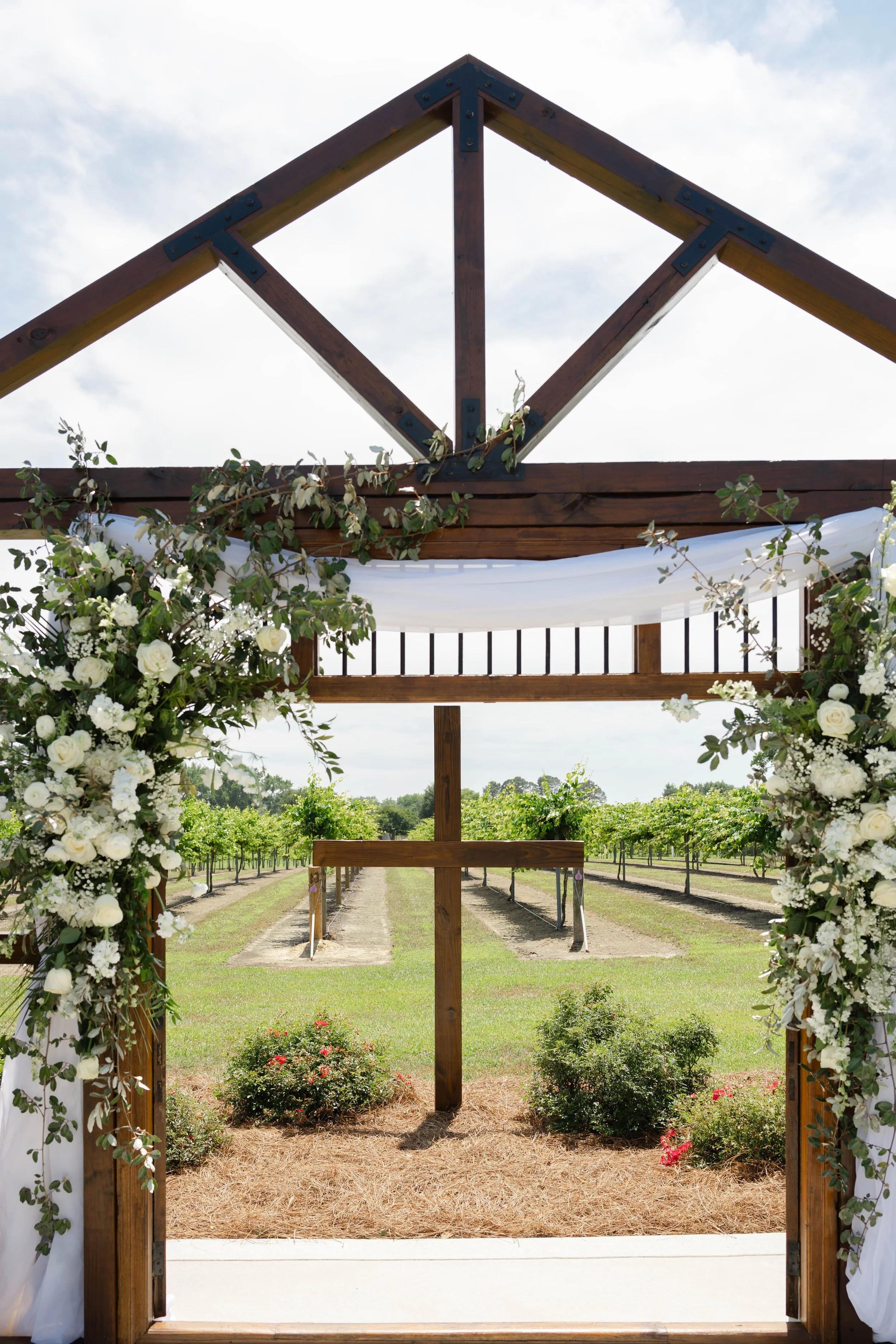 Unique Ceremony Arbor with Cross at Vineyard