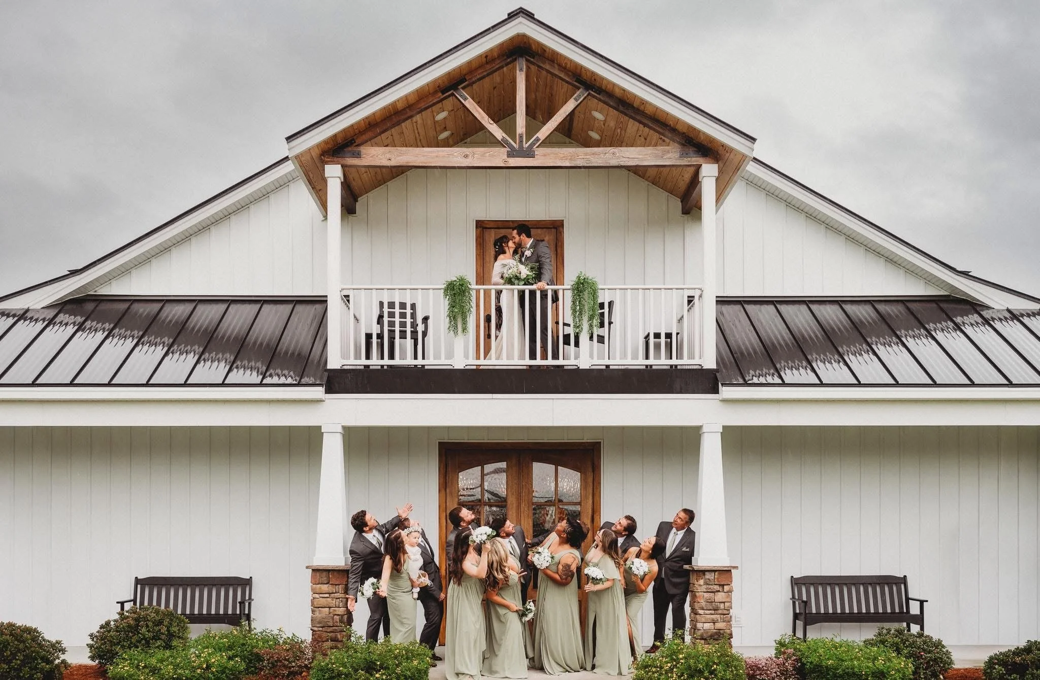 balcony wedding party bride groom modern venue vineyard NC