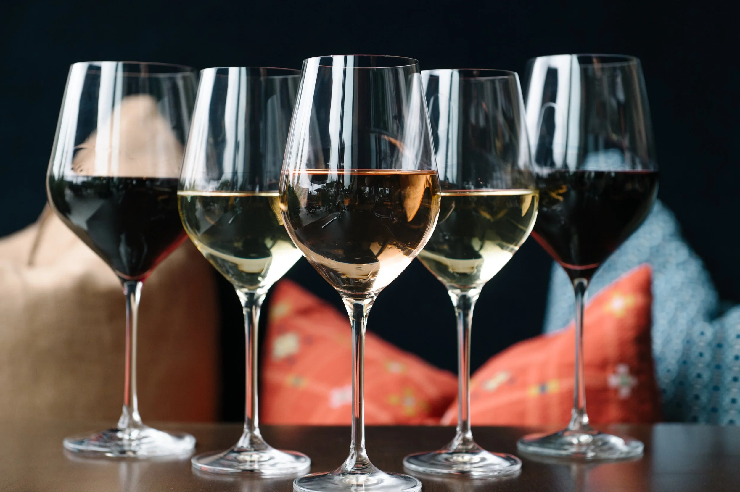 Guests enjoying wine and dinner during Wine-Down Wednesday at Table 128 in Des Moines