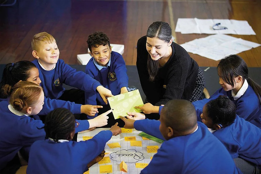 teacher and pupils doing an activity