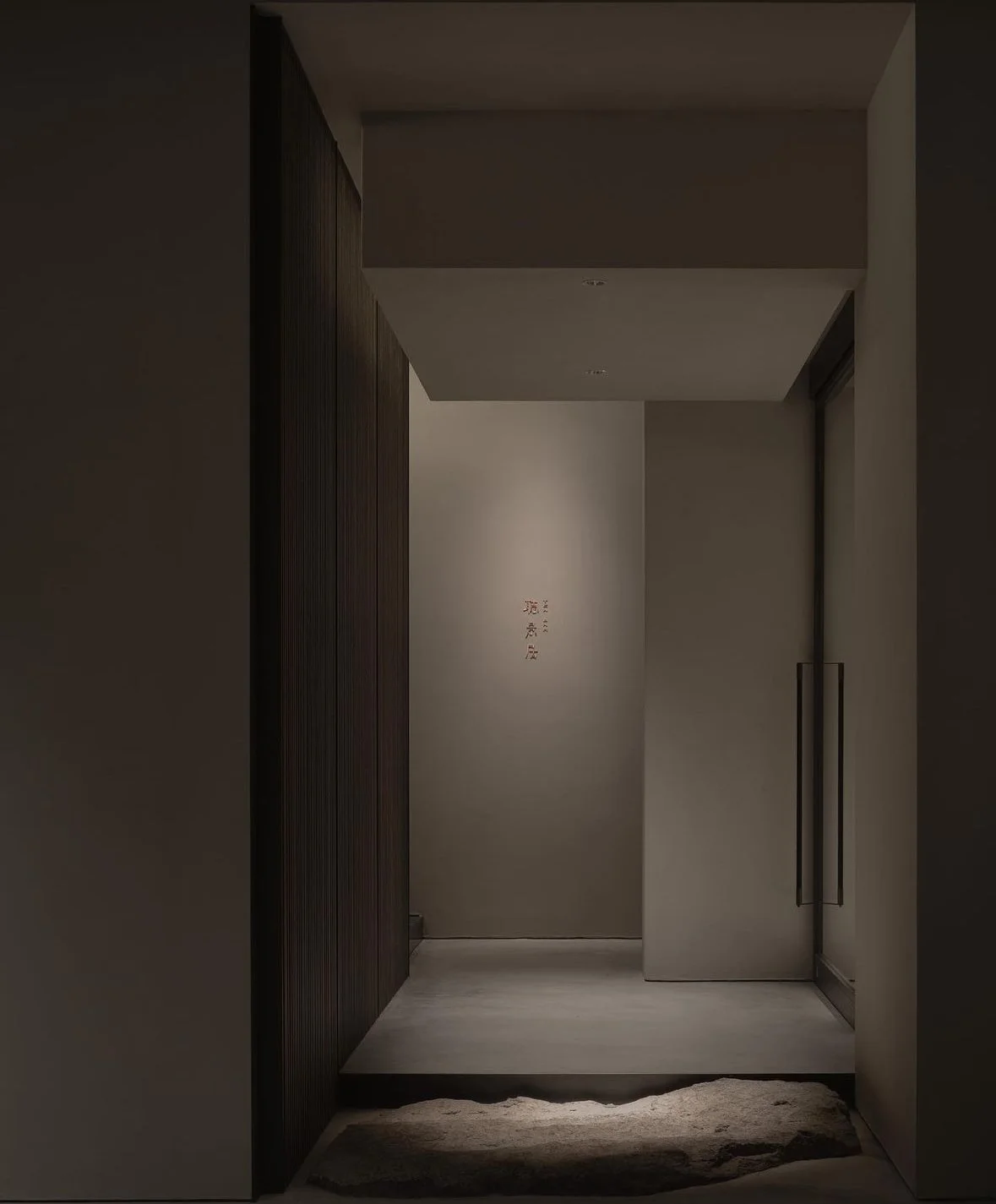 Minimalist luxury hotel corridor — private travel advisory for ultra-high-net-worth clients by Julien Nolan, Husseau Houston