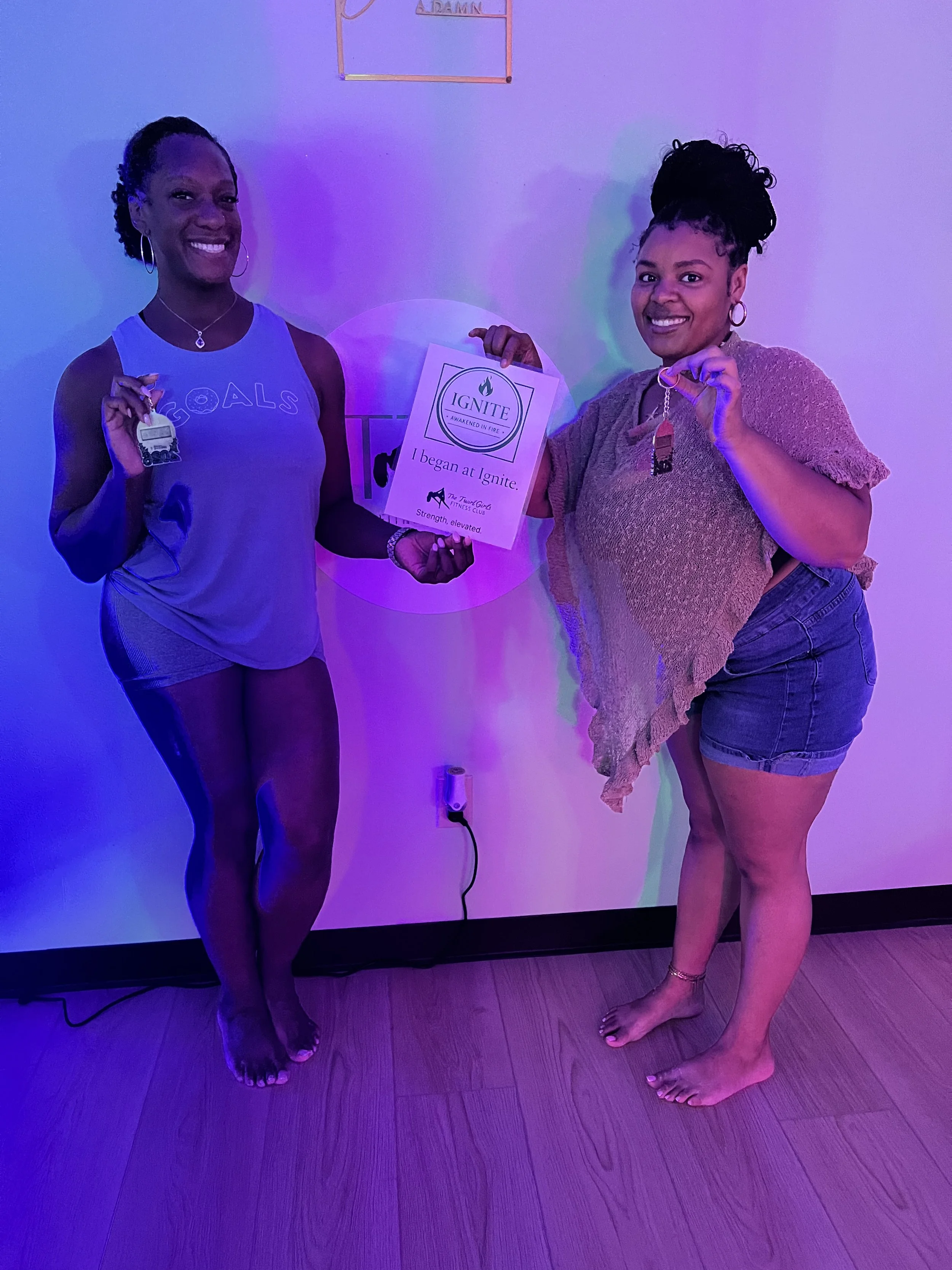 Woman graduating from the beginner pole Initiation Series at The Twirl Girls Fitness Club in Greensboro NC
