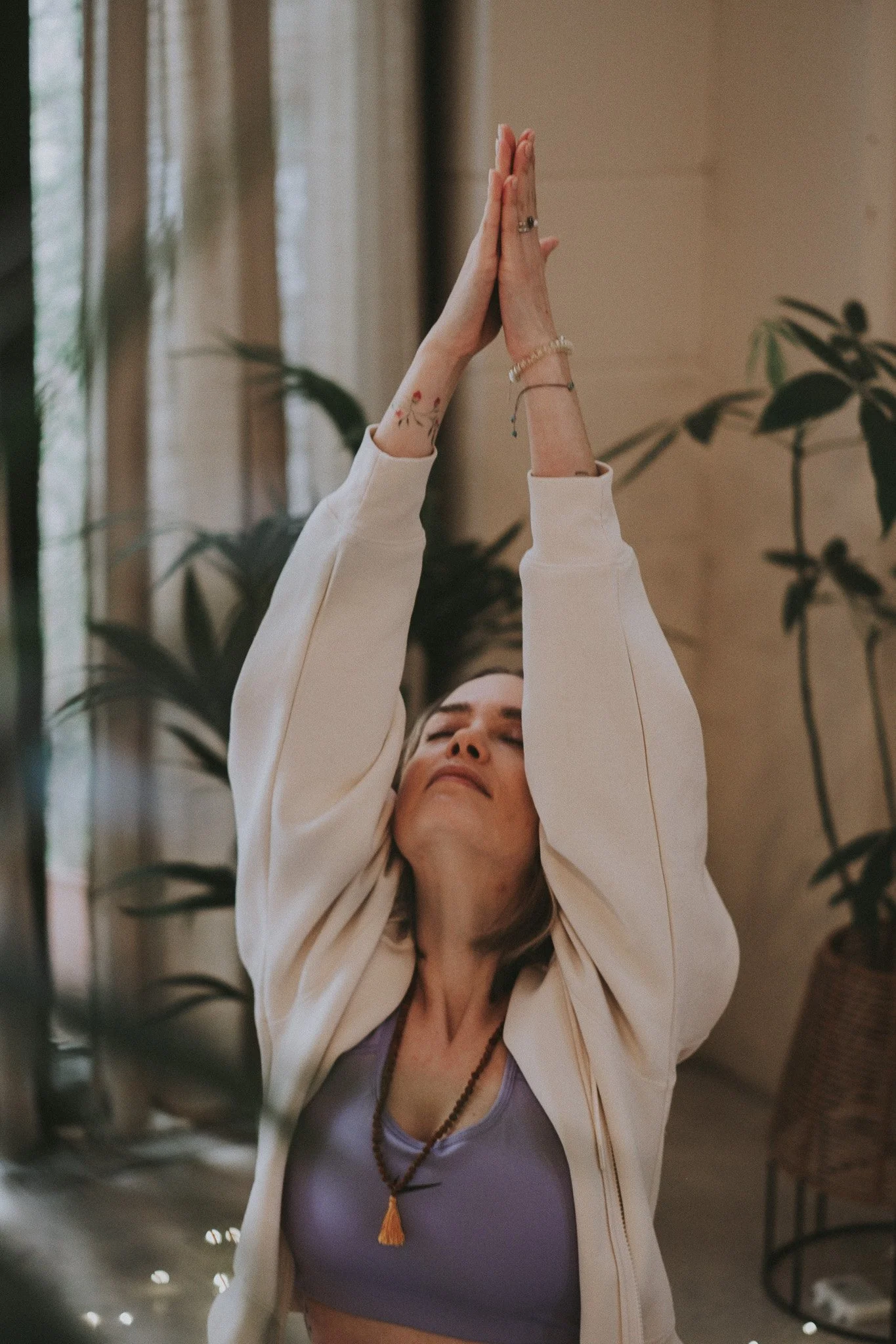 Catarina moving through a gentle yoga posture