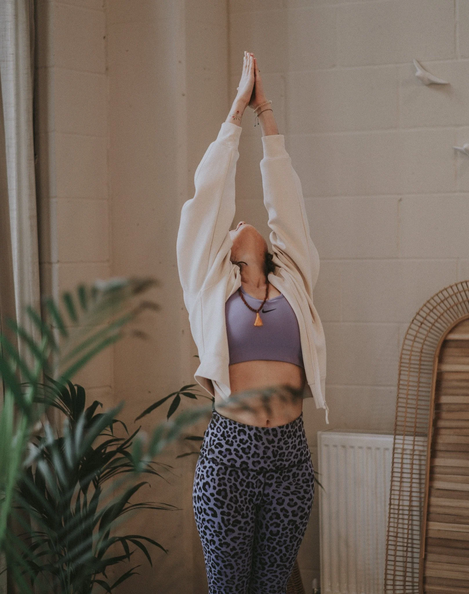 Catarina doing a yoga standing stretch