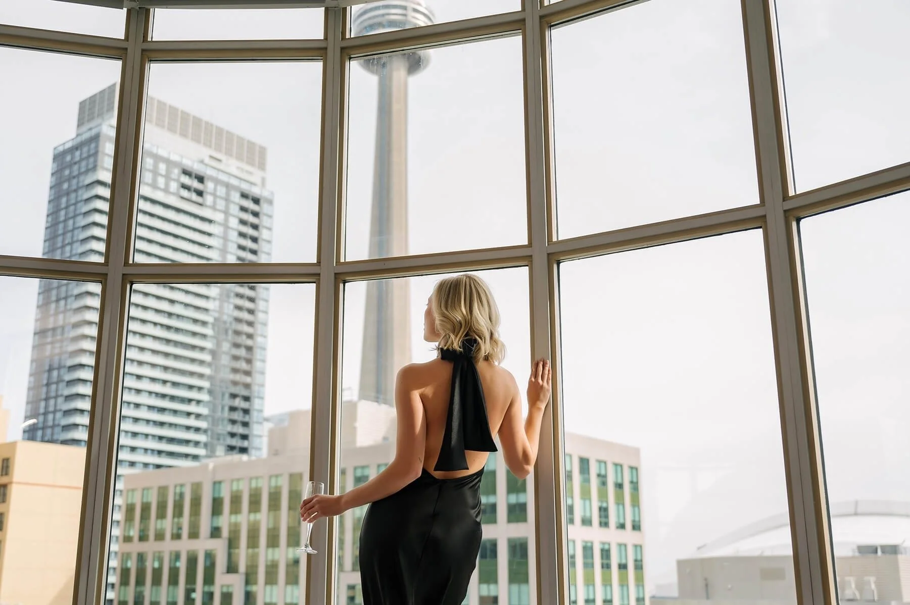 Woman looking out the window at SoHo Penthouse