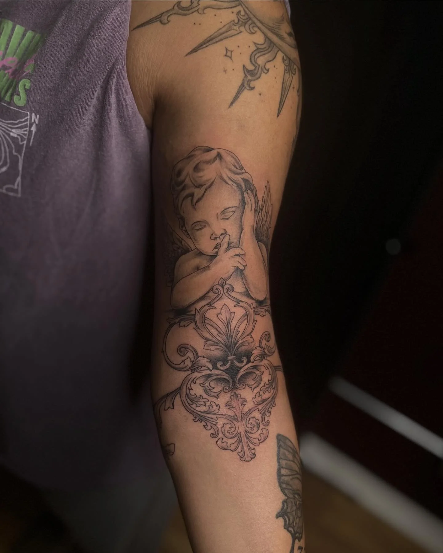 For Mac - We added a beautiful custom cherub, dagger, spider, and filigree work to her arm!
This was such a fun and cool idea to work with. Her whole arm is symbolic to who she is, courage, fear, and all. I can&rsquo;t wait to see how it all comes to