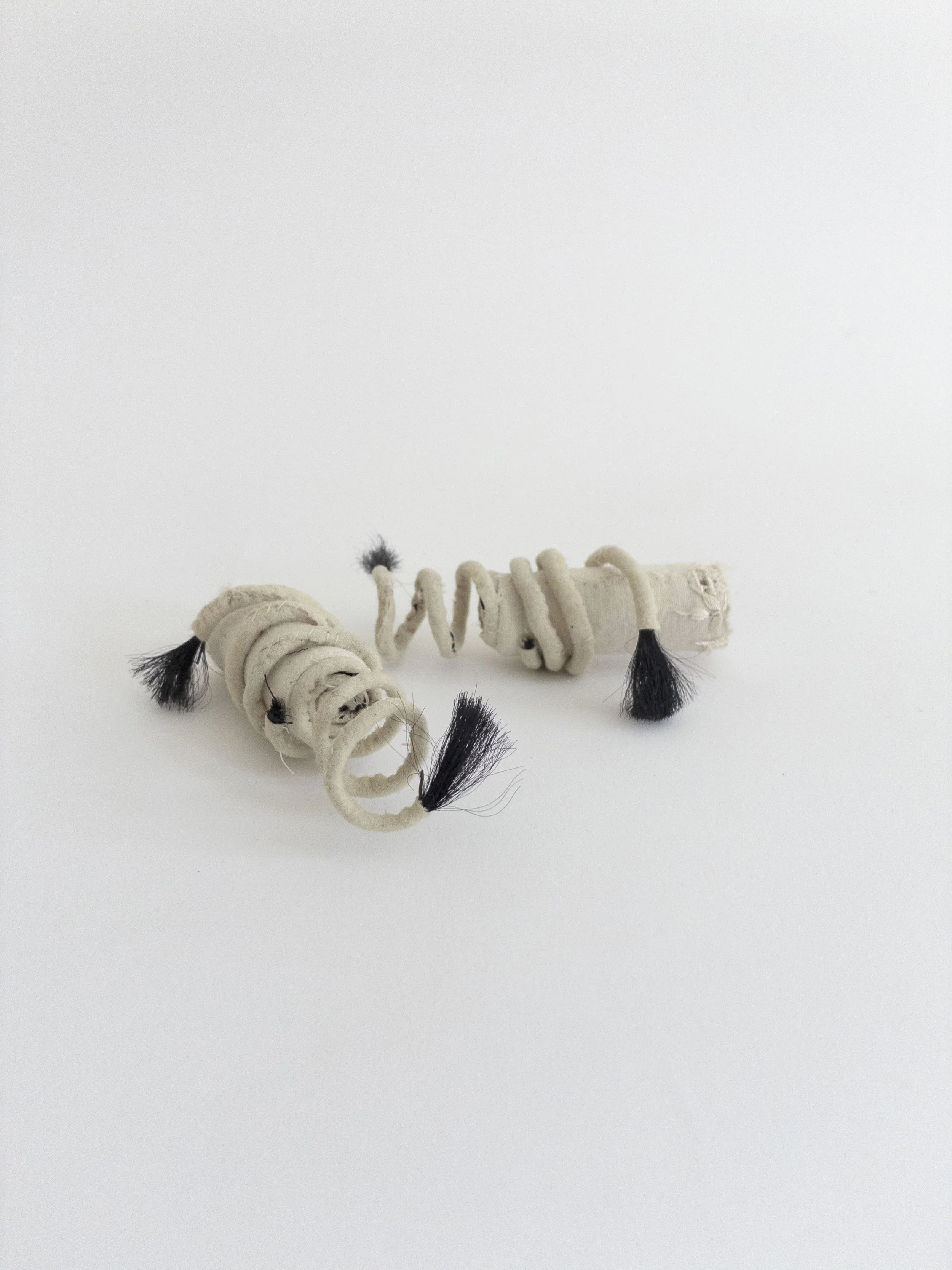 Dendrite I and II, 2025, wool, cotton, metal, horsehair, 1.5 x 4.5 x 2 inches