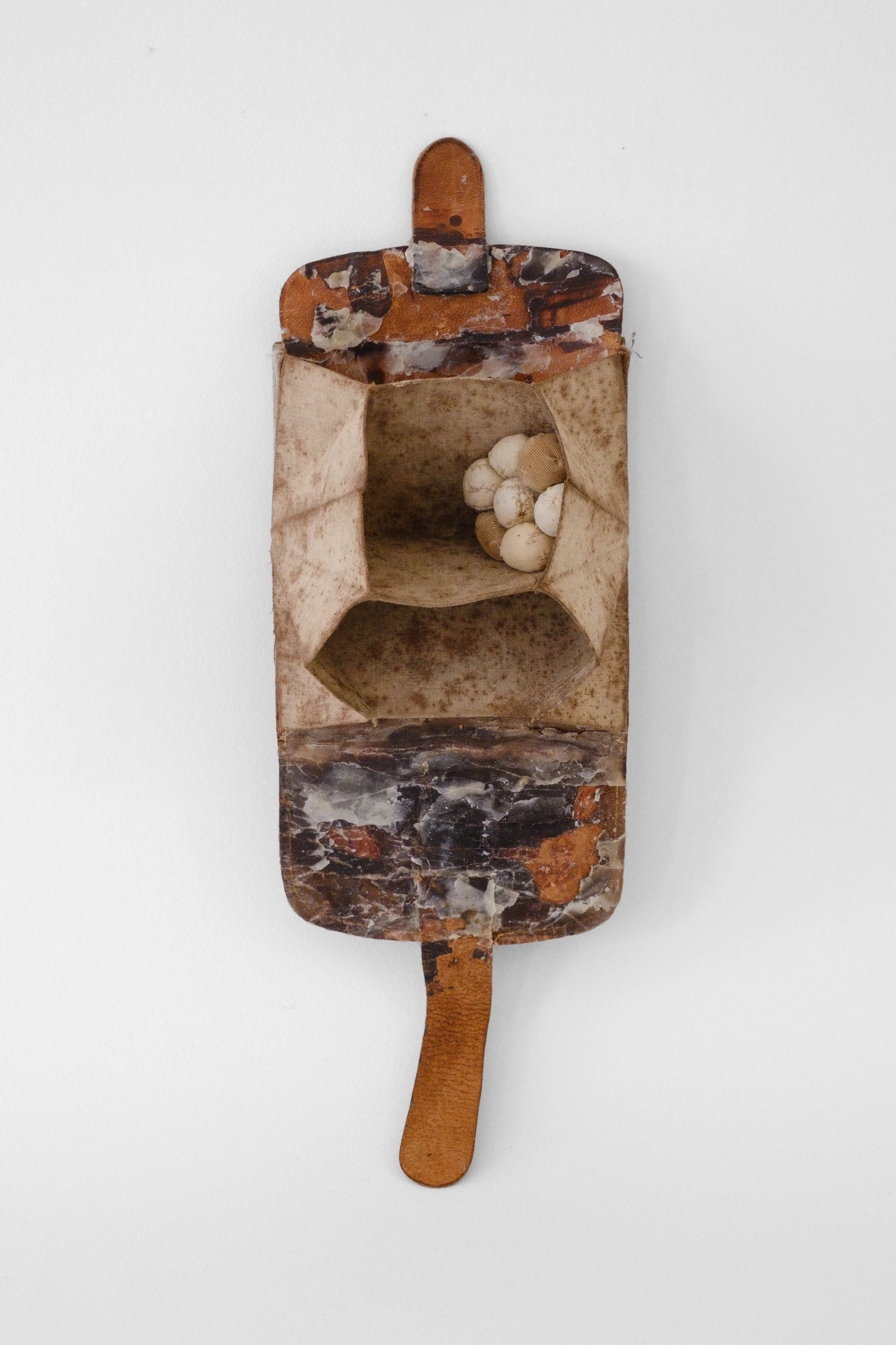Contingent, 2025, leather, beeswax, cotton, 12.5 x 4 x 3 inches
