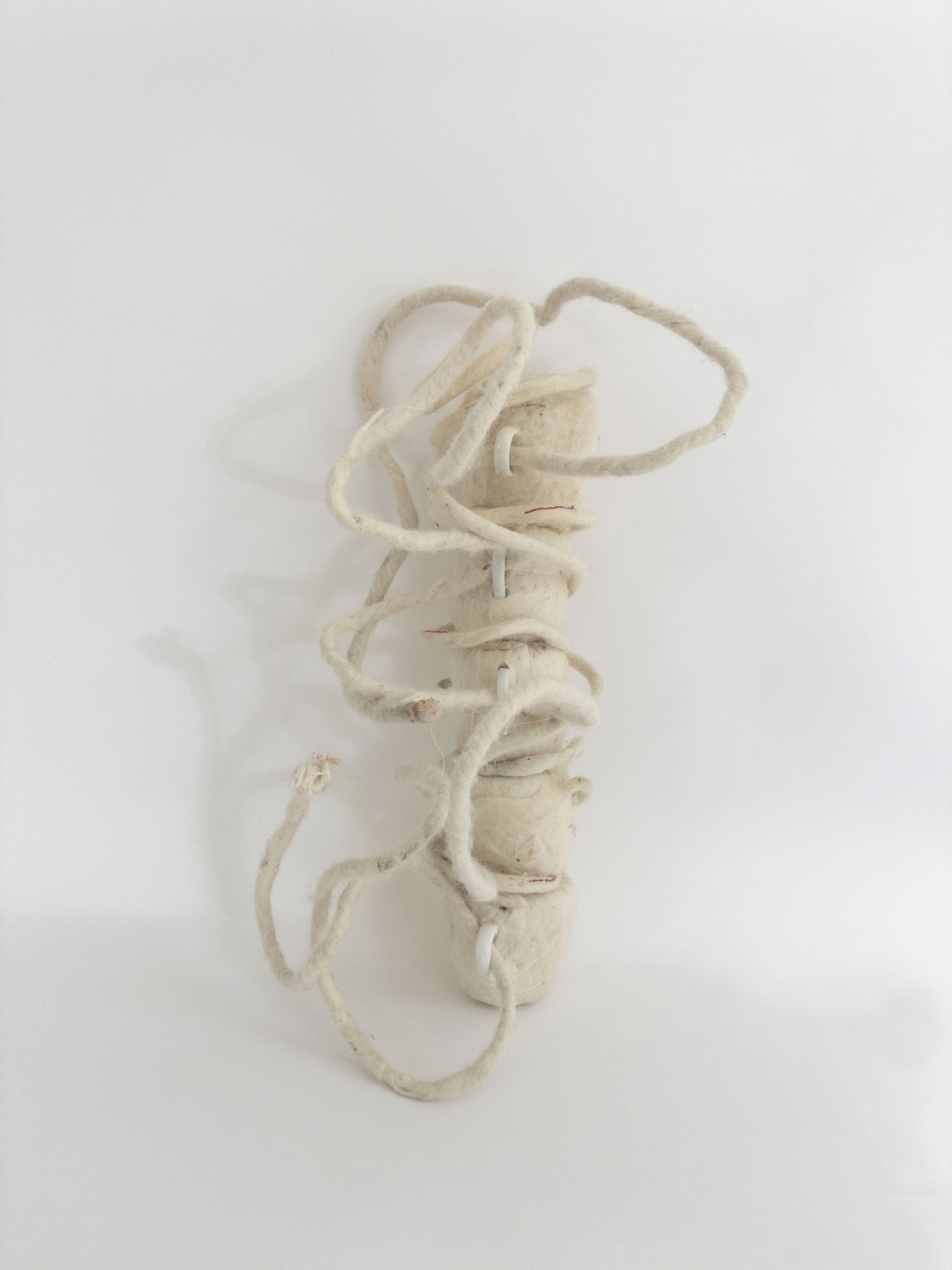 Nerve, 2014-2026. wool, ceramic, cotton,&nbsp;17 x 7 x 8 inches