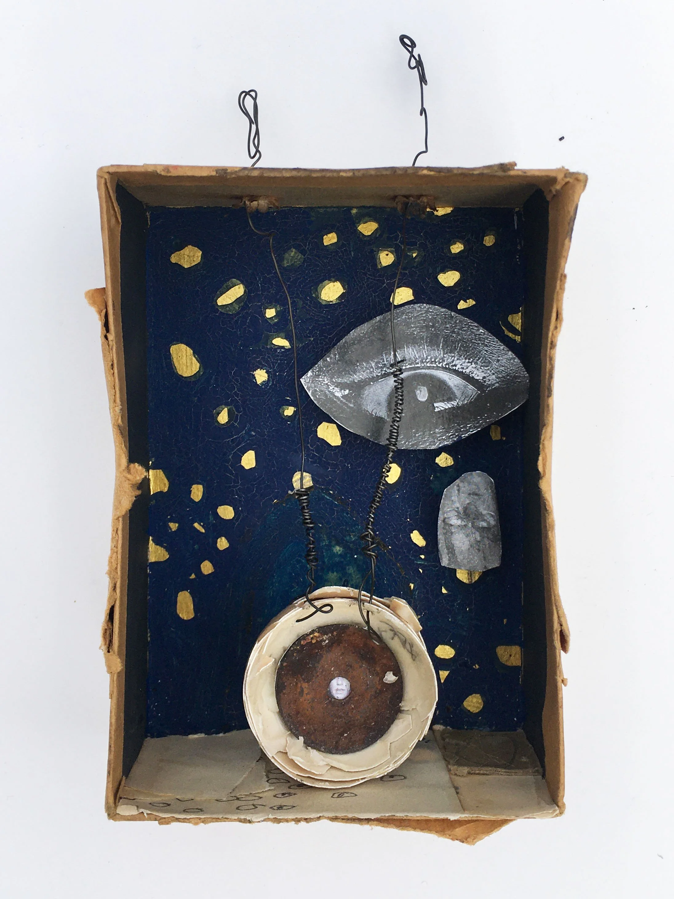 Luminosity of Fear, 2020. Box lid, wire, eggshell, paper, gouache, gold paint. 5.2 x 4 x 2 inches
