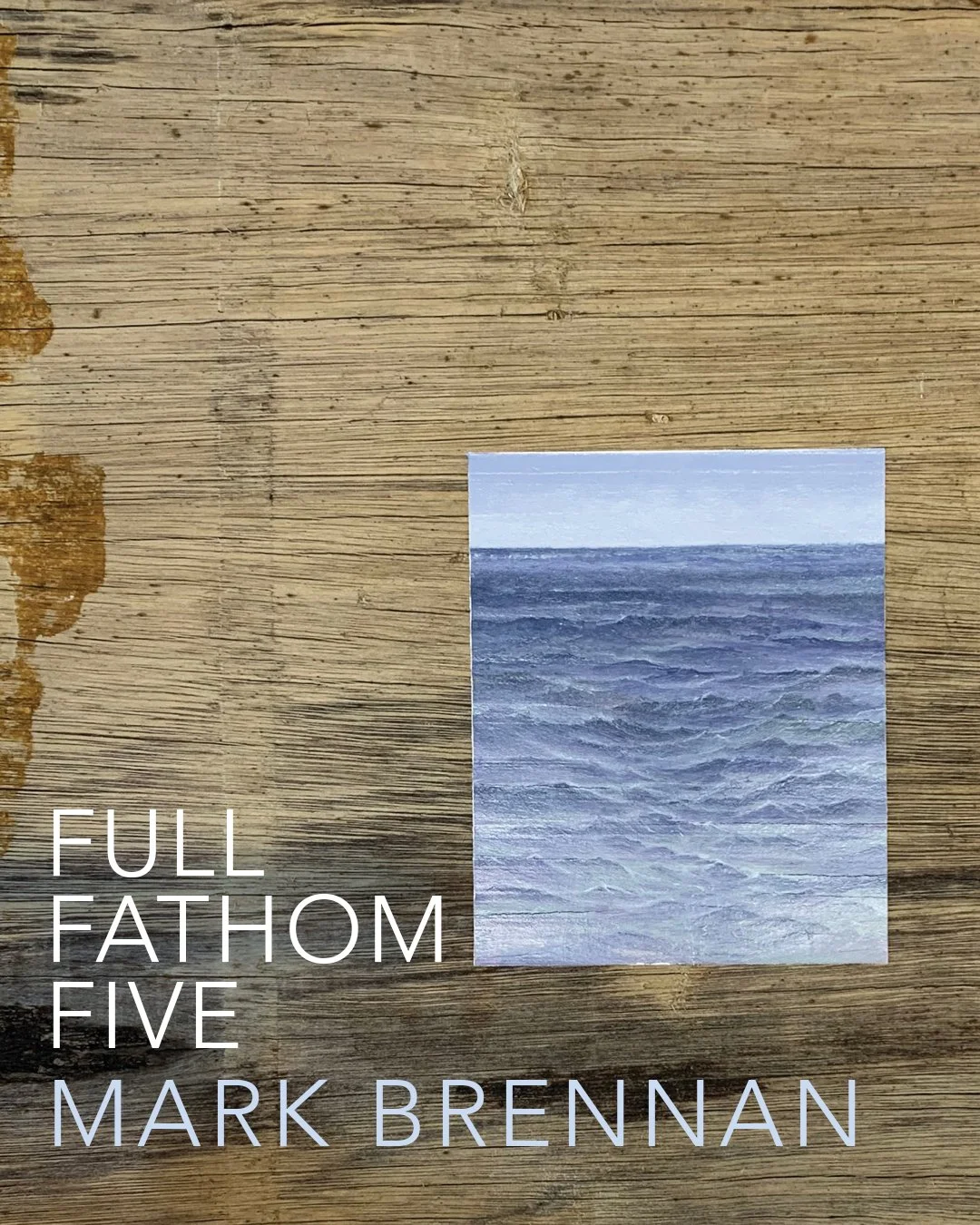 A book cover with a small photo of the ocean on a wooden surface. The title reads "Full Fathom Five" by Mark Brennan
