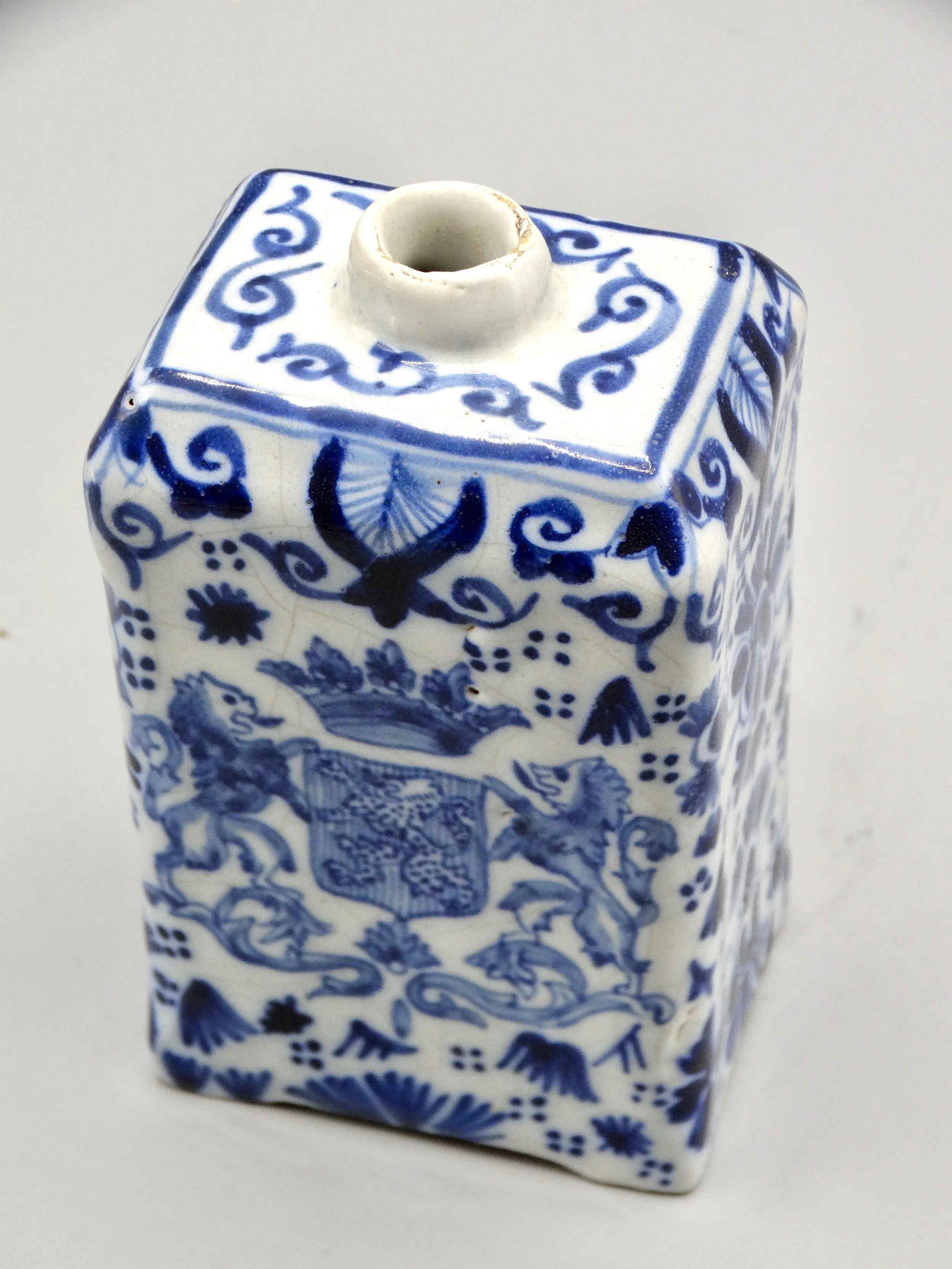 Chamfered shoulder and rim detail on 19th-century English Delft tea caddy.