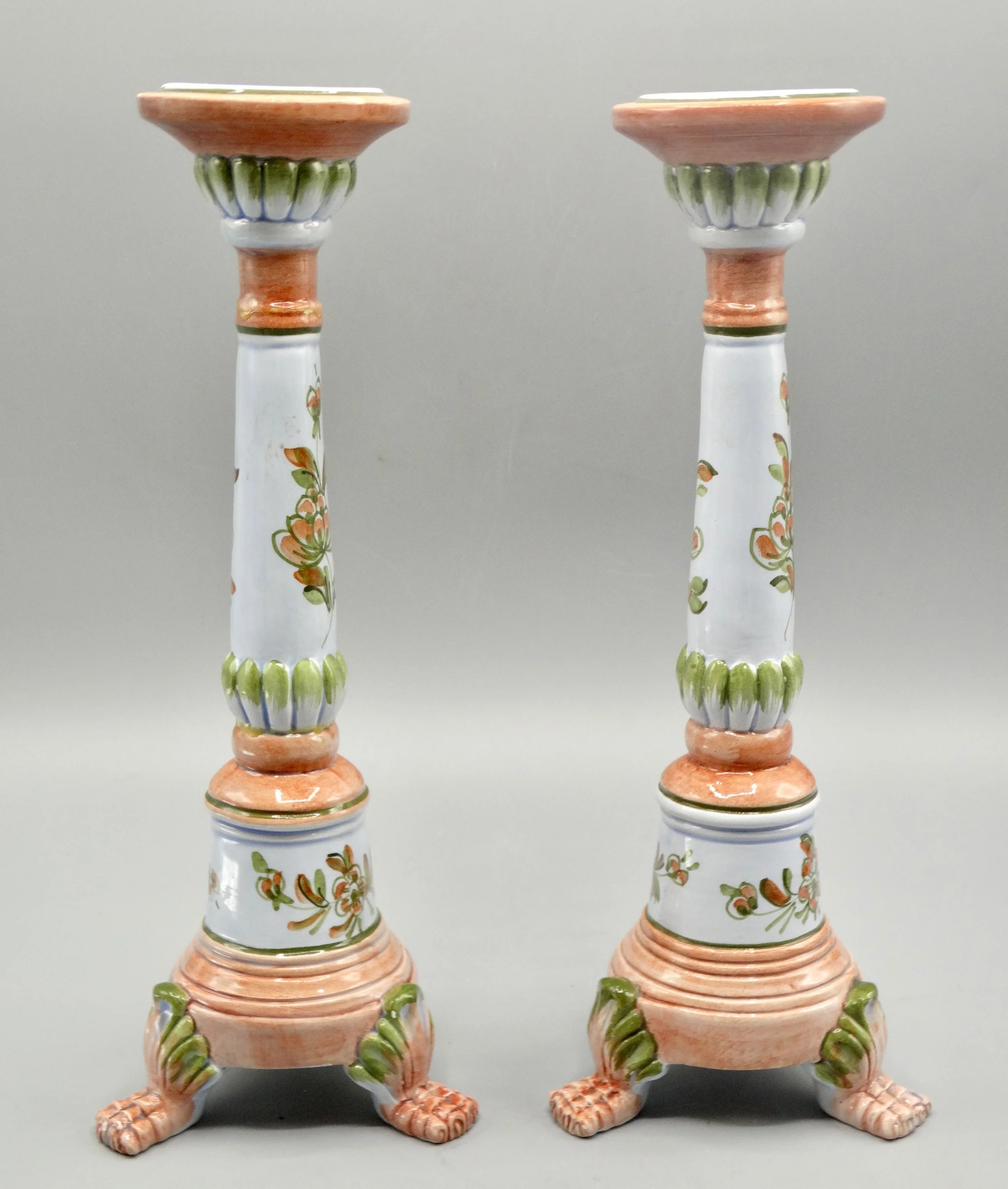 Side view of vintage Italian faience candlestick, hand painted floral motif, mid-century, raised on paw feet