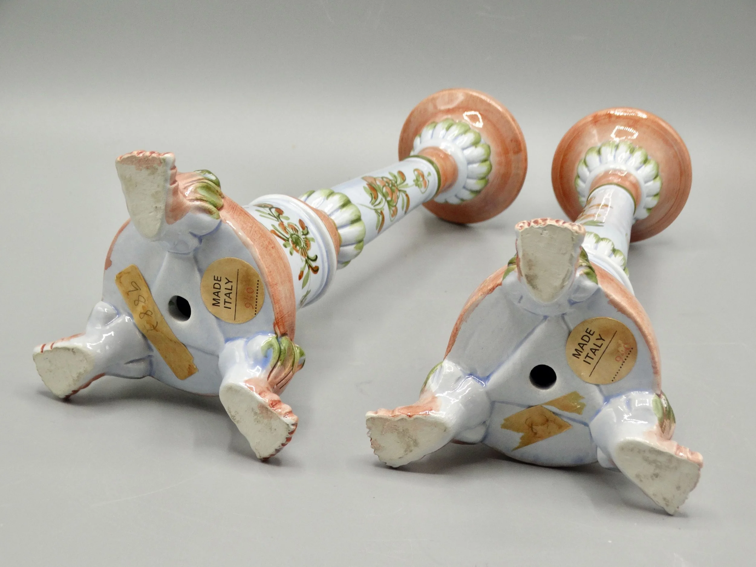 Reverse of vintage Italian faience candlesticks showing Italy mark and hand painted craftsmanship