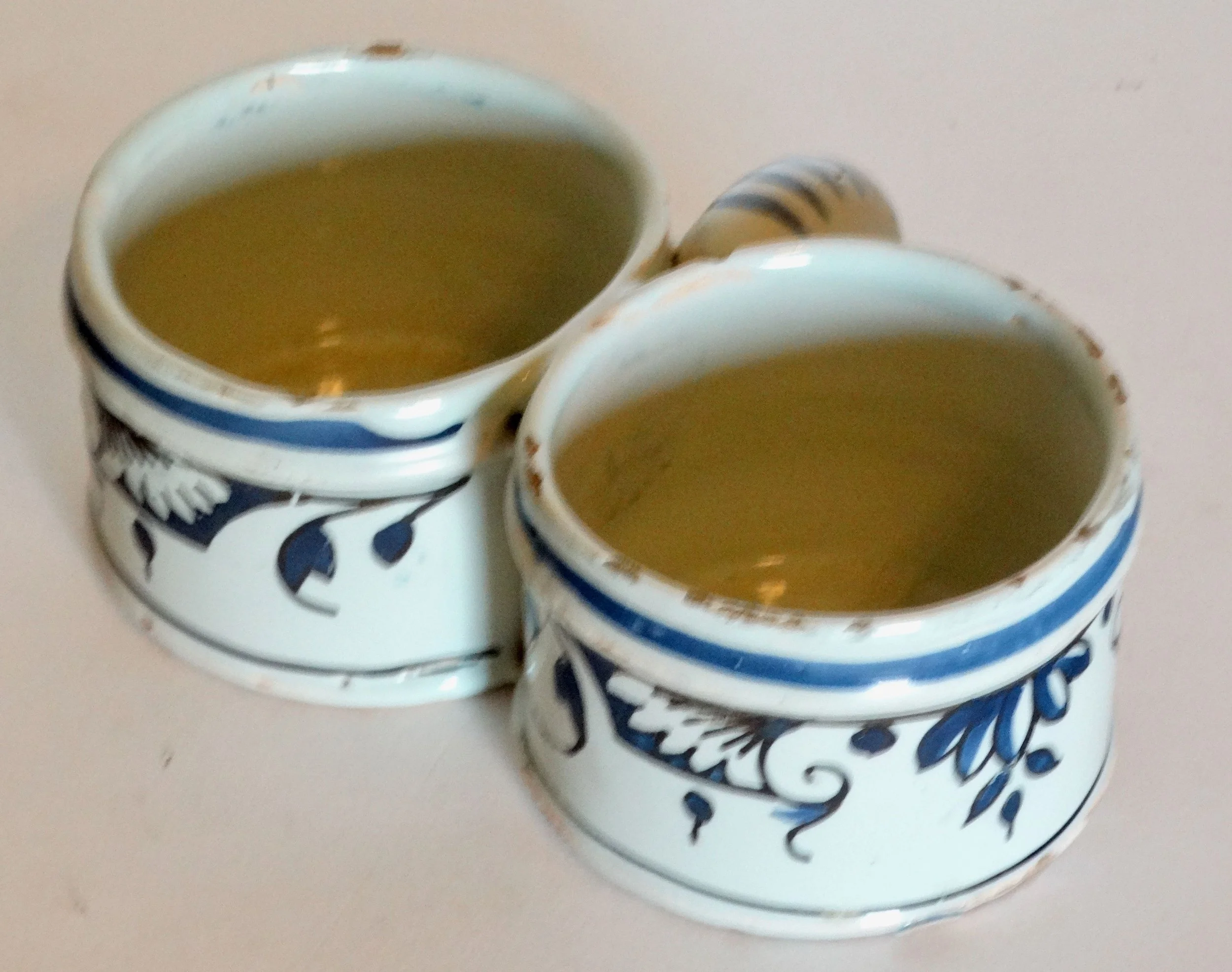 18th-century Delft faience presentier double dish, hand painted with delicate floral geometric pattern and border