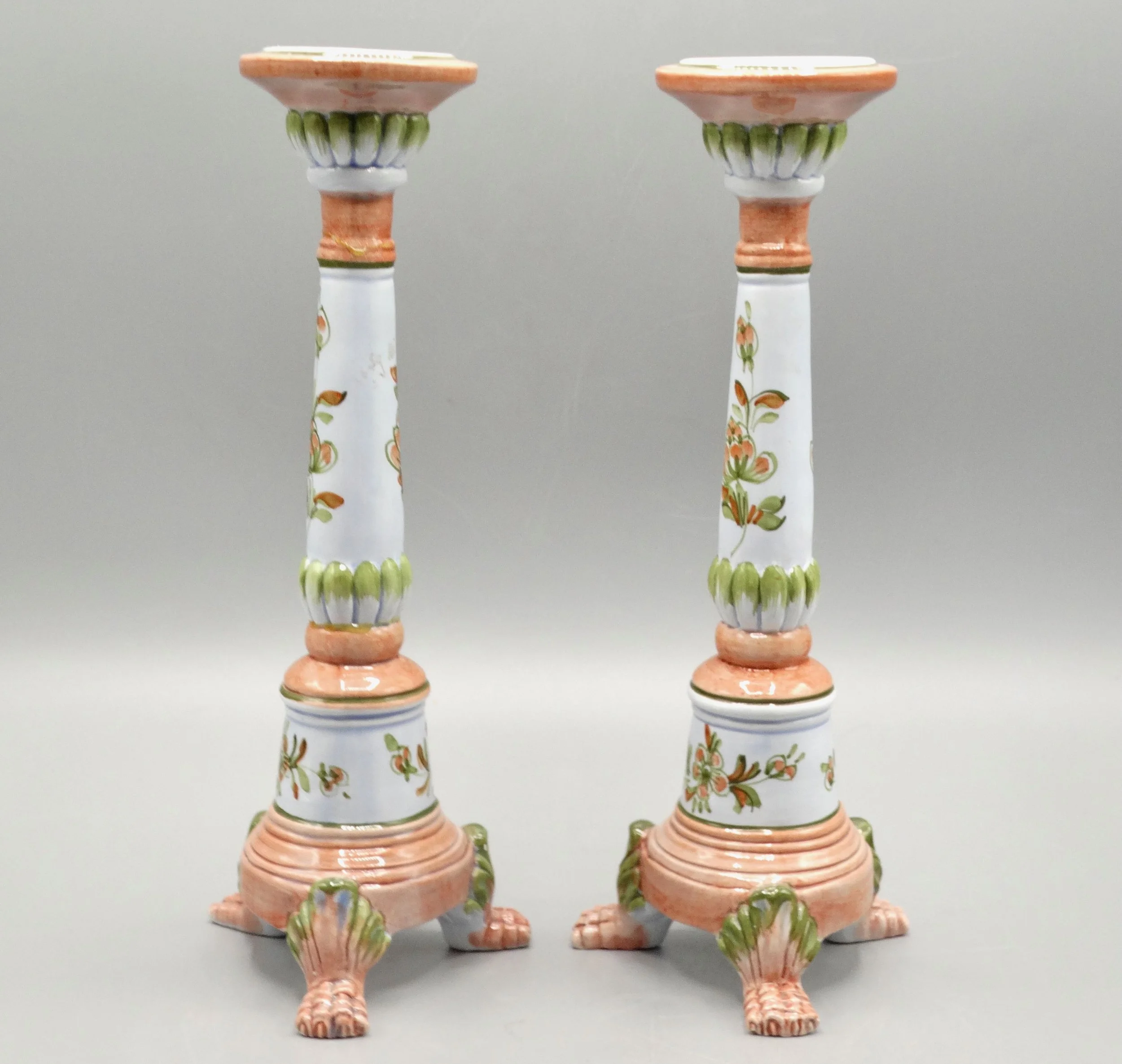 Side view of vintage Italian faience candlestick, hand painted floral motif, mid-century, raised on paw feet