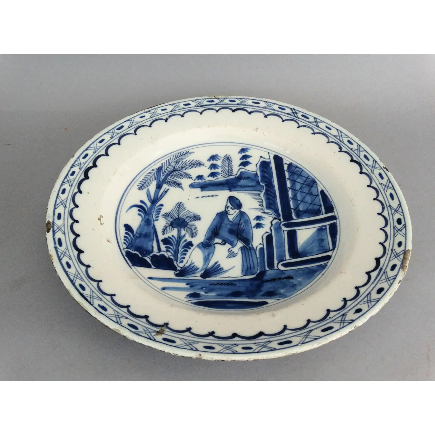 Side profile of antique Dutch Delft blue and white chinoiserie charger, 18th century faience pottery