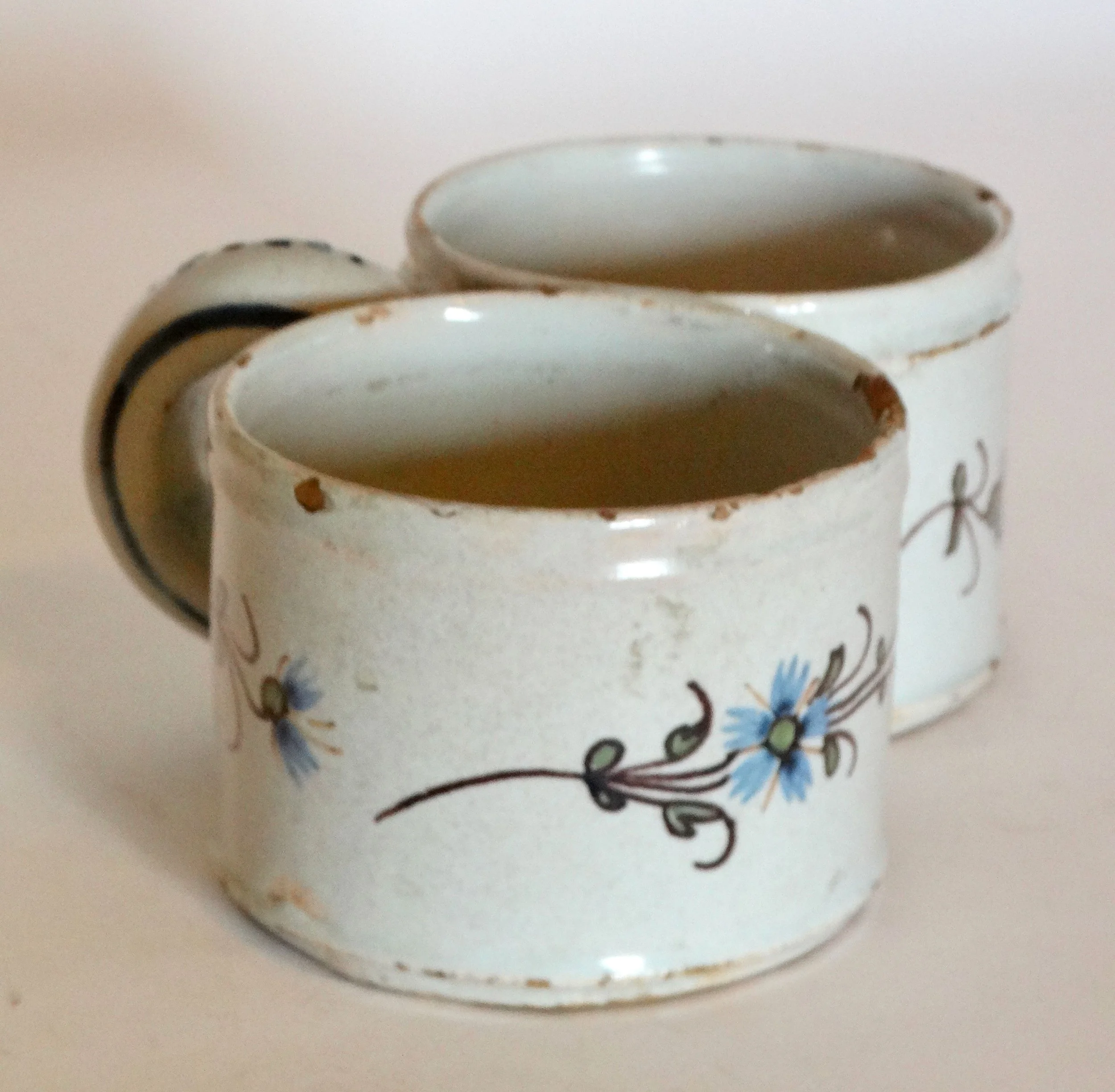 Close-up of first dish on antique Delft presentier double dish, showing hand painted polychrome floral geometric design