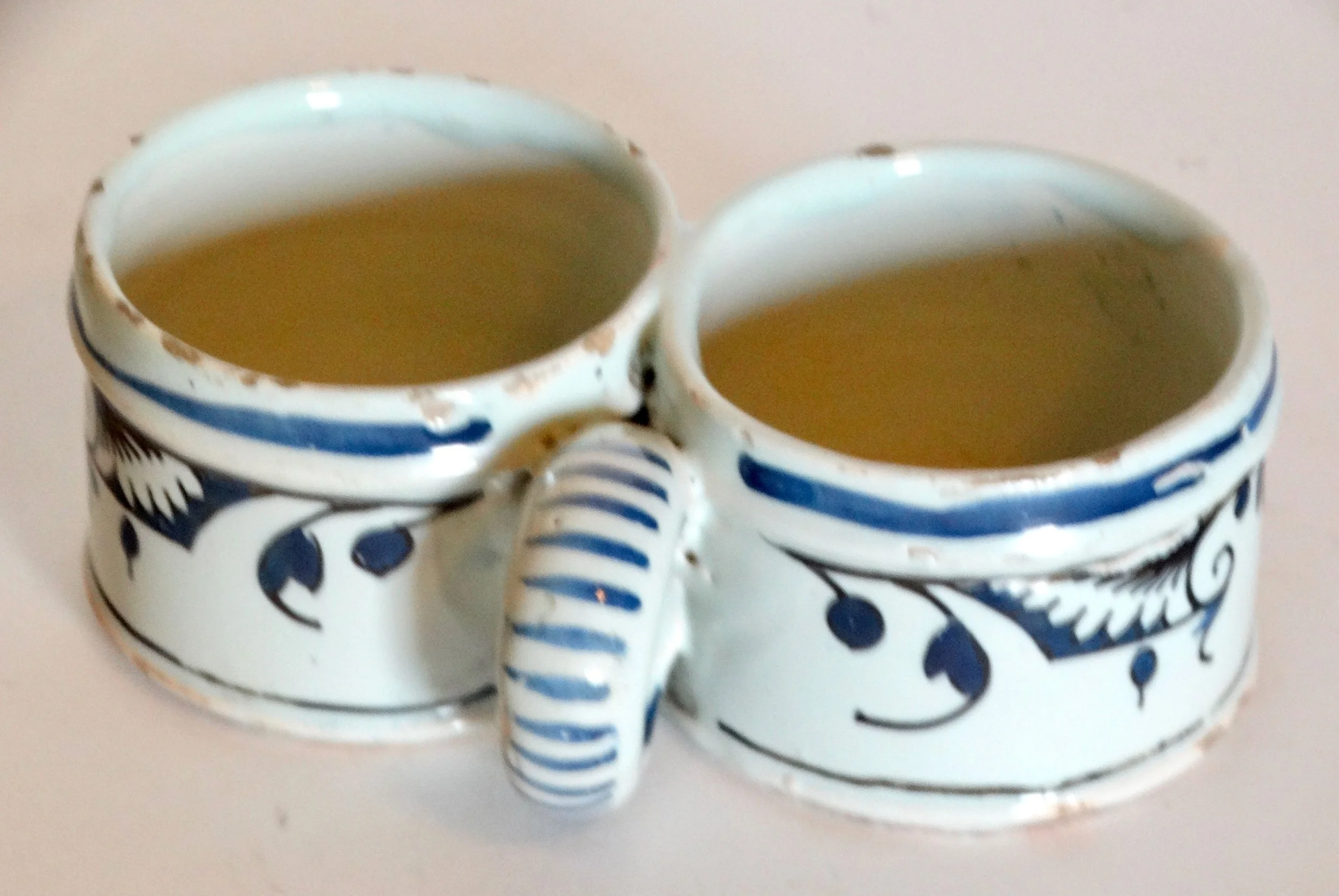 18th-century Delft faience presentier double dish, hand painted with delicate floral geometric pattern and border