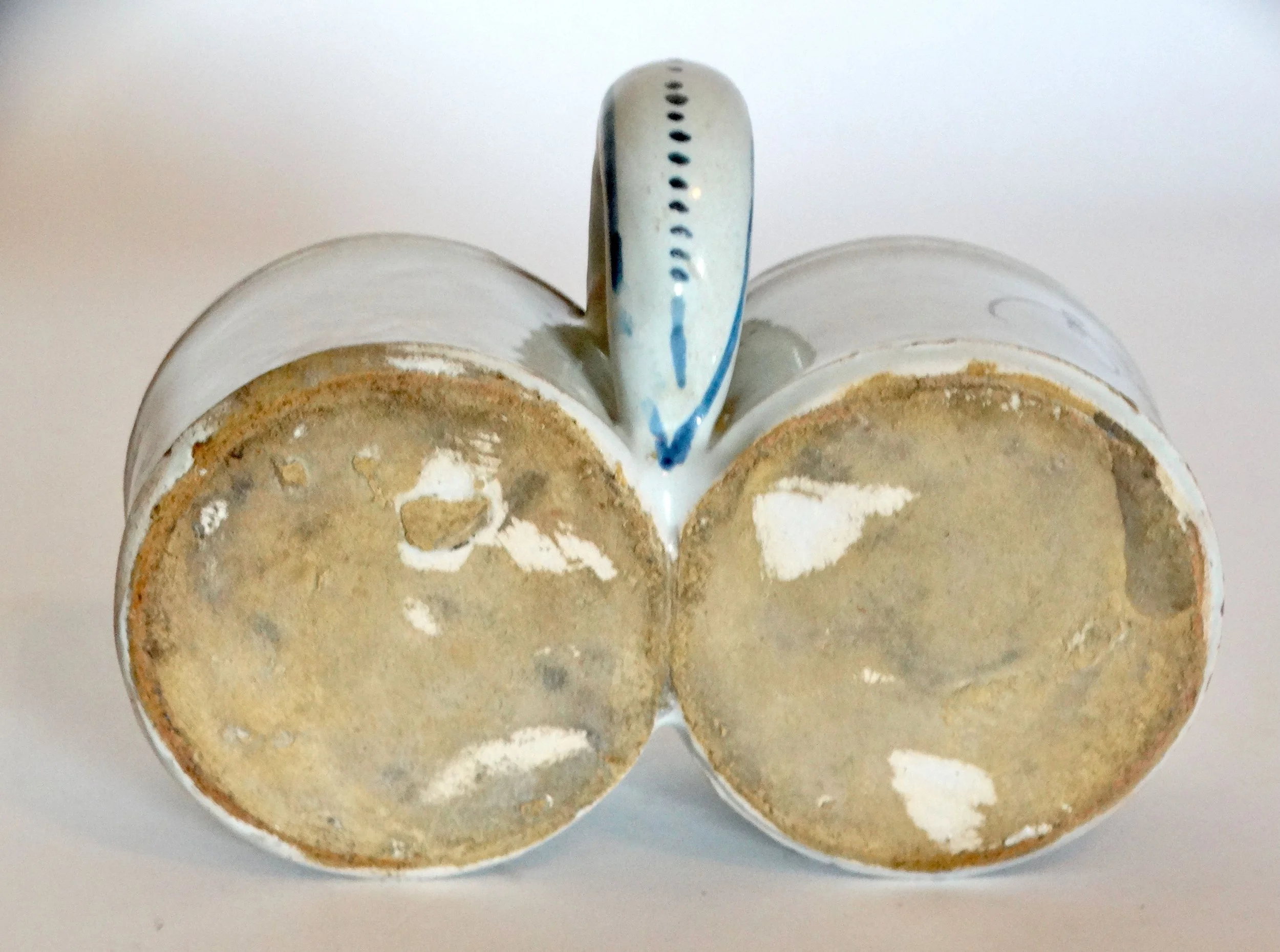 Bottom of 18th-century Delft faience presentier double dish, showing hand molded base and Delftware craftsmanship