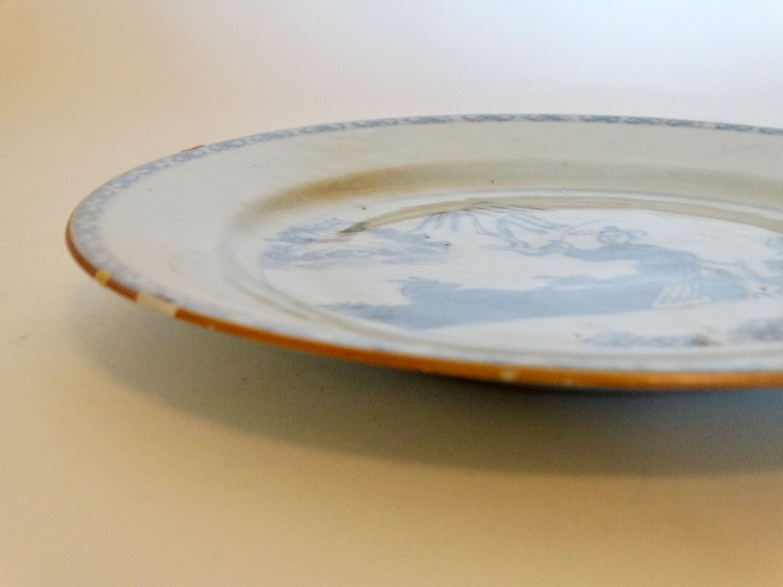 Hand painted floral and geometric rim of 18th-century English Delftware chinoiserie plate, expressive border detail