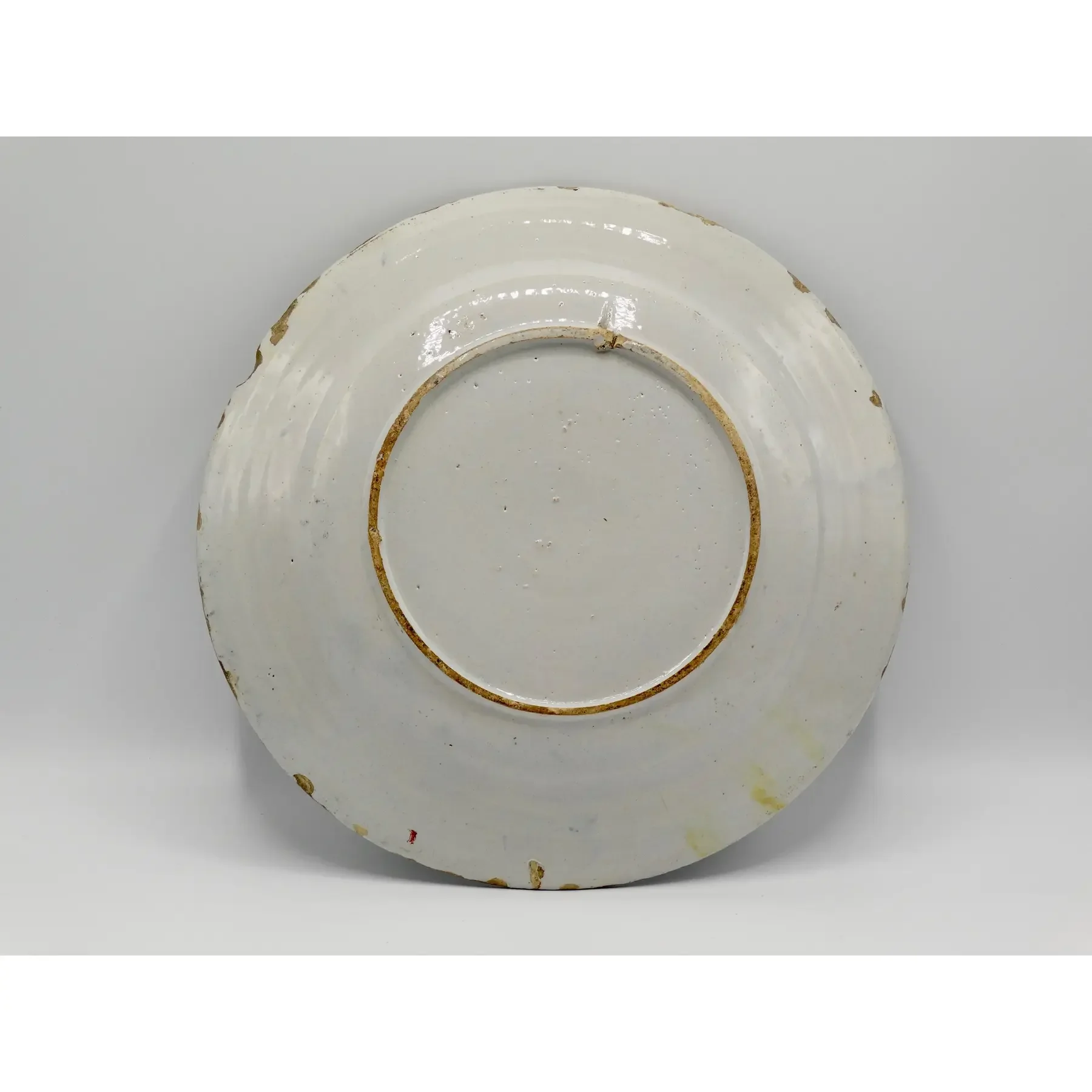 Reverse of antique Dutch Delft faience charger.