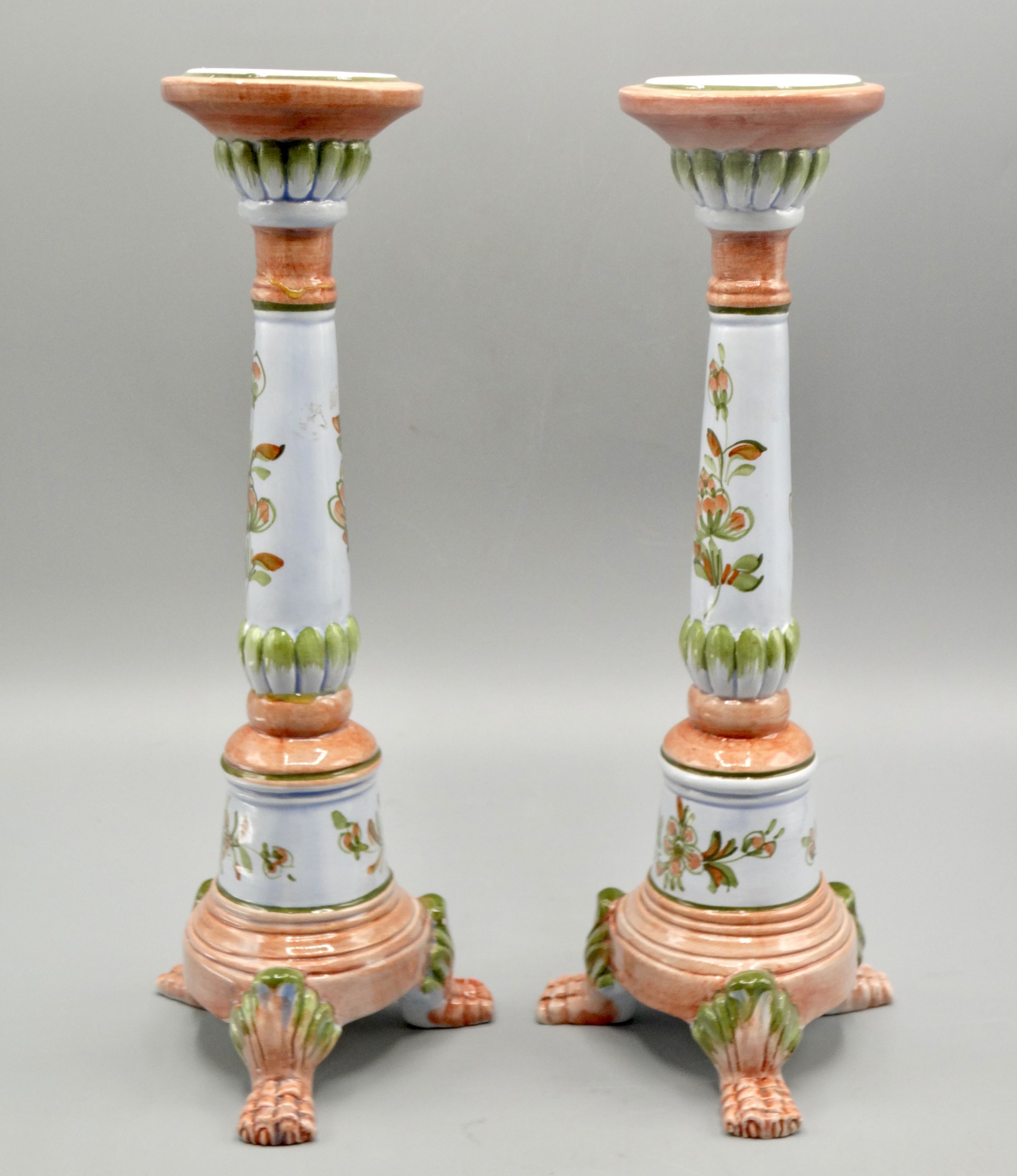 Side view of vintage Italian faience candlestick, hand painted floral motif, mid-century, raised on paw feet