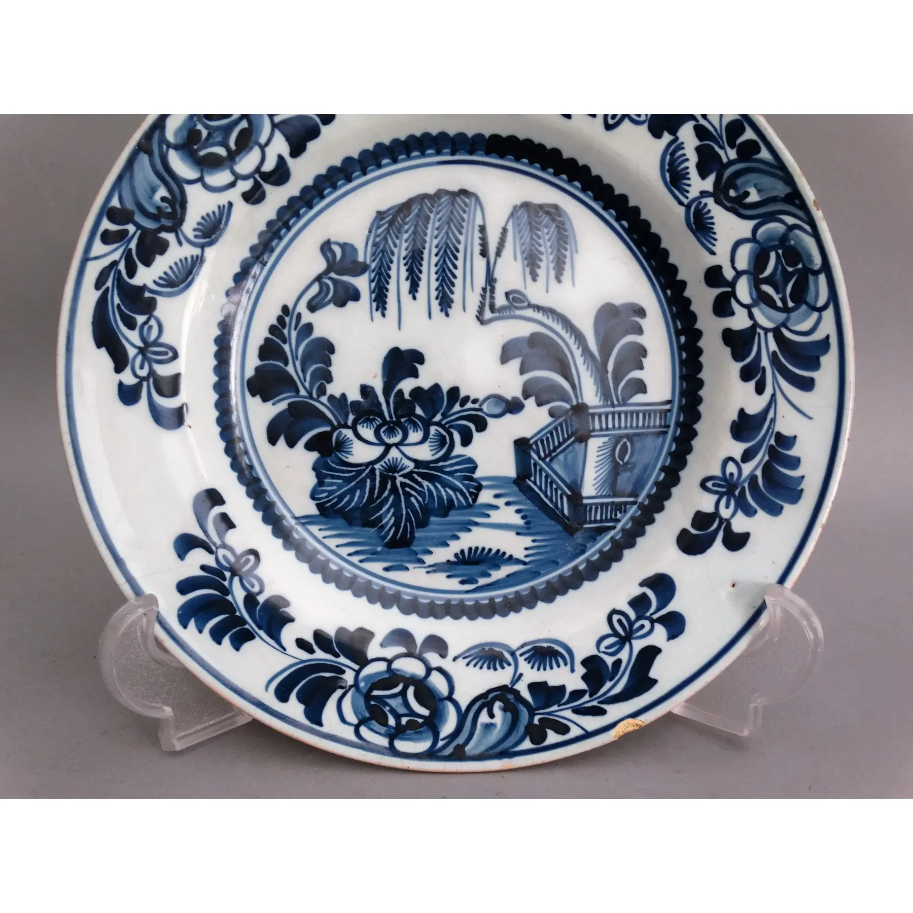 Willow tree landscape on antique 18th century Delft chinoiserie plate.