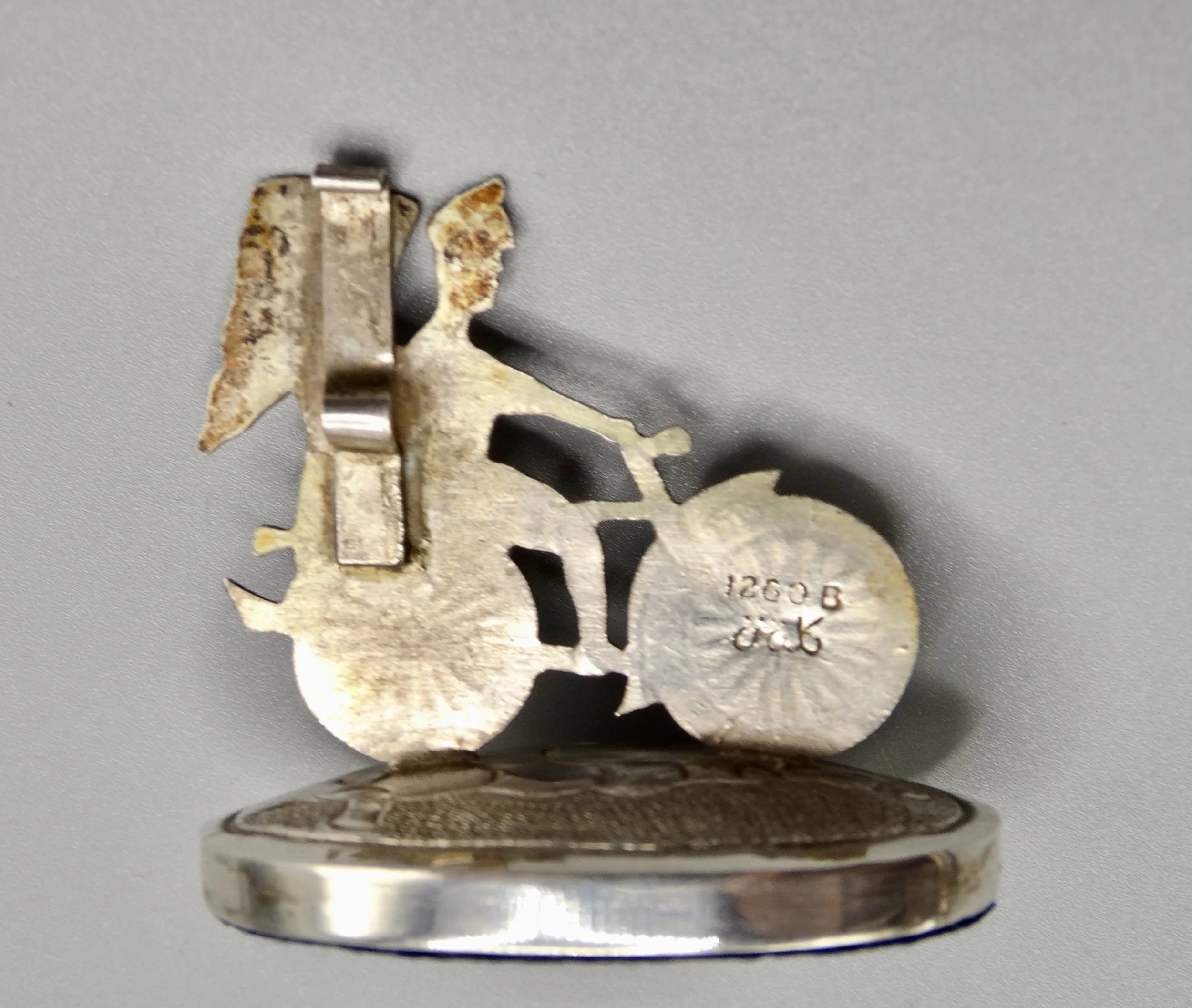 Reverse of Chinese sterling silver rickshaw holders showing maker’s marks and clip mechanism.